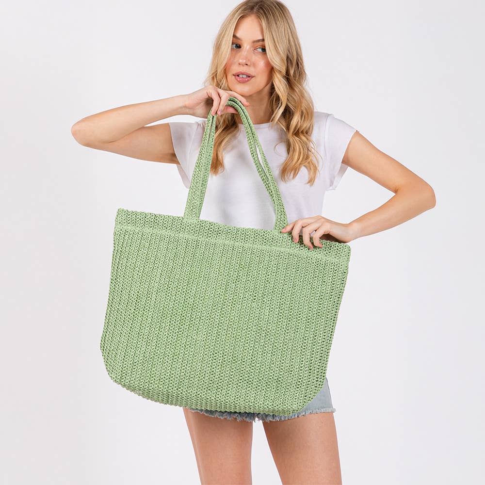 Solid crochet straw tote bag, private label beach handbag with woven design and sturdy handles, perfect for summer outings.