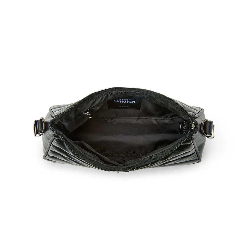 Think Royln Cosmopolitan bag in a stylish design, showcasing a sleek exterior and practical features.