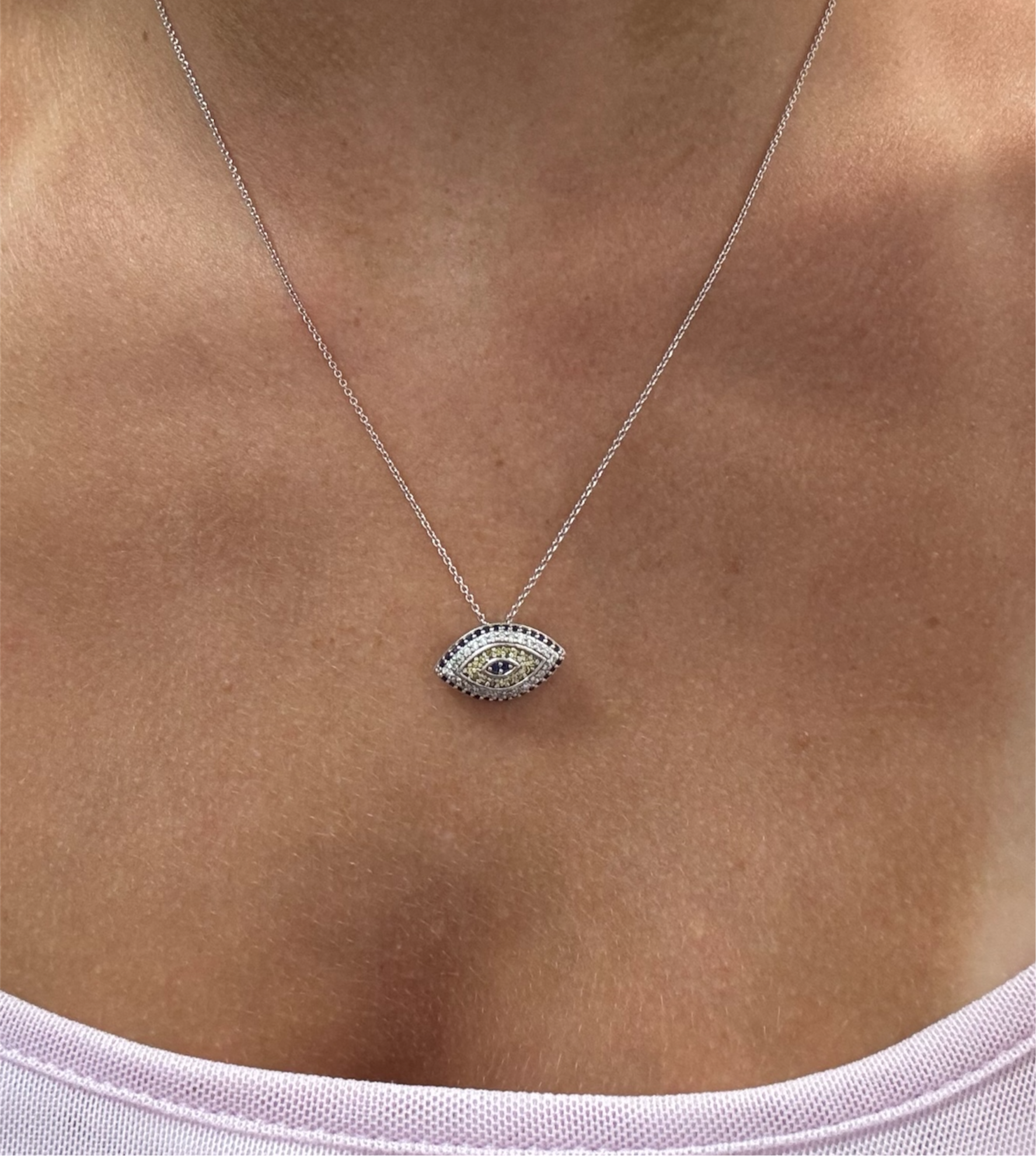 Sterling silver 925 Evil Eye studded necklace with delicate charm, showcasing intricate design and craftsmanship.