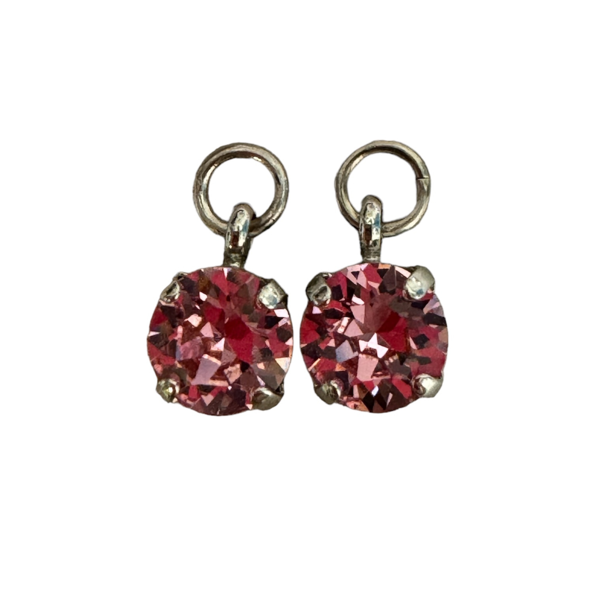 Pink crystal charm earrings from a private label, showcasing sparkling details and a stylish design.