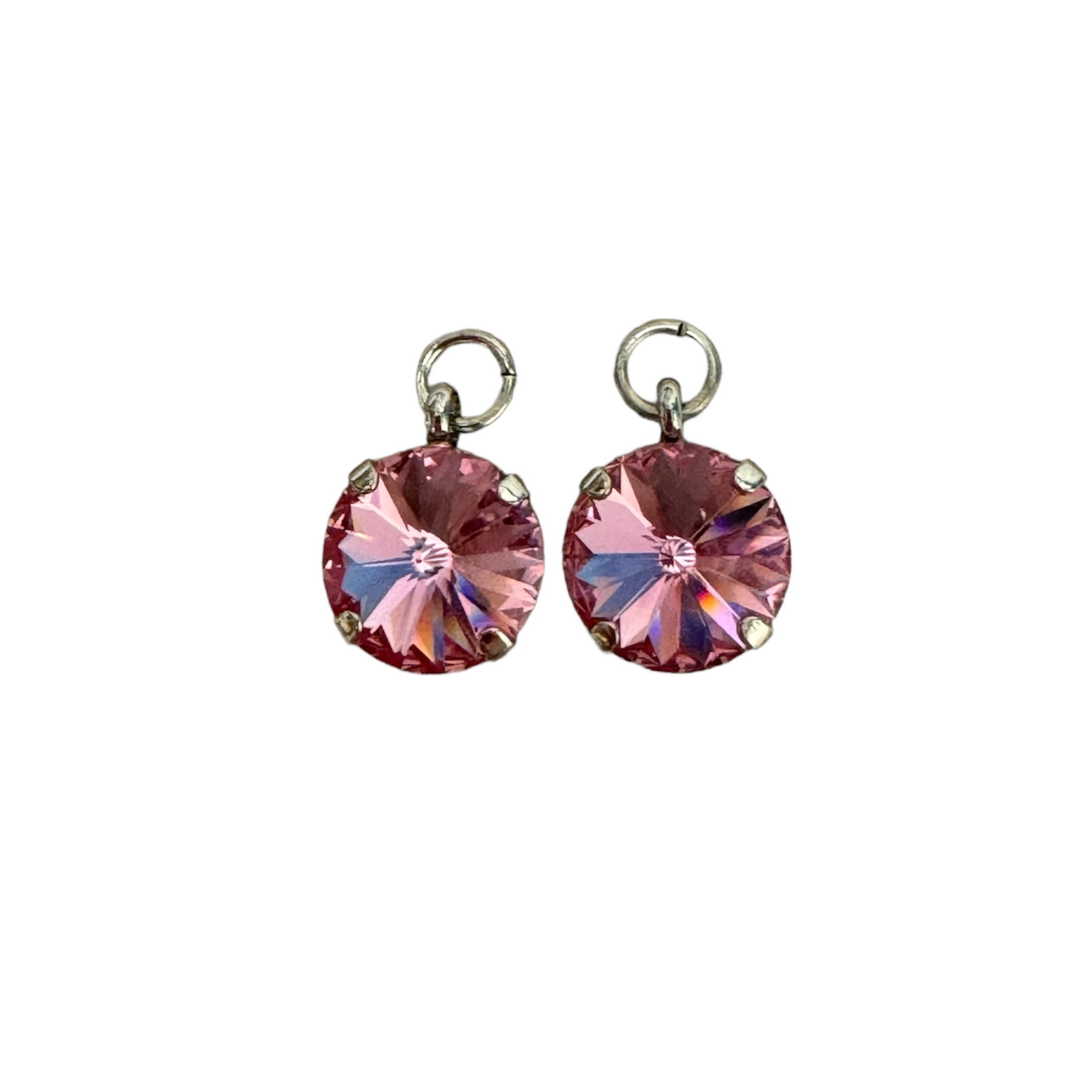 Pink crystal charm earrings featuring a delicate design, perfect for adding a touch of elegance to any outfit.