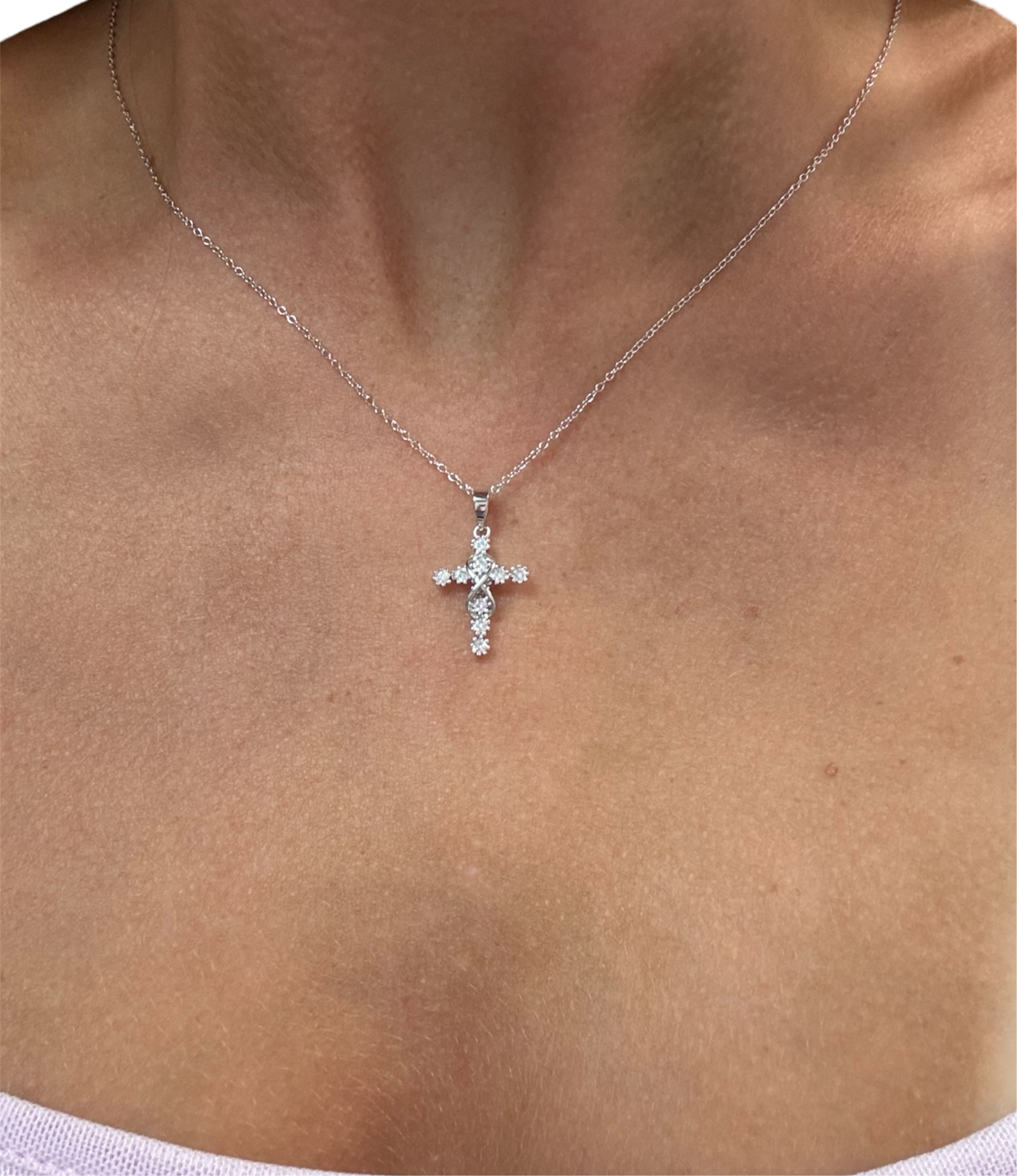 Sterling silver 925 infinity studded cross necklace with intricate detailing and a polished finish.
