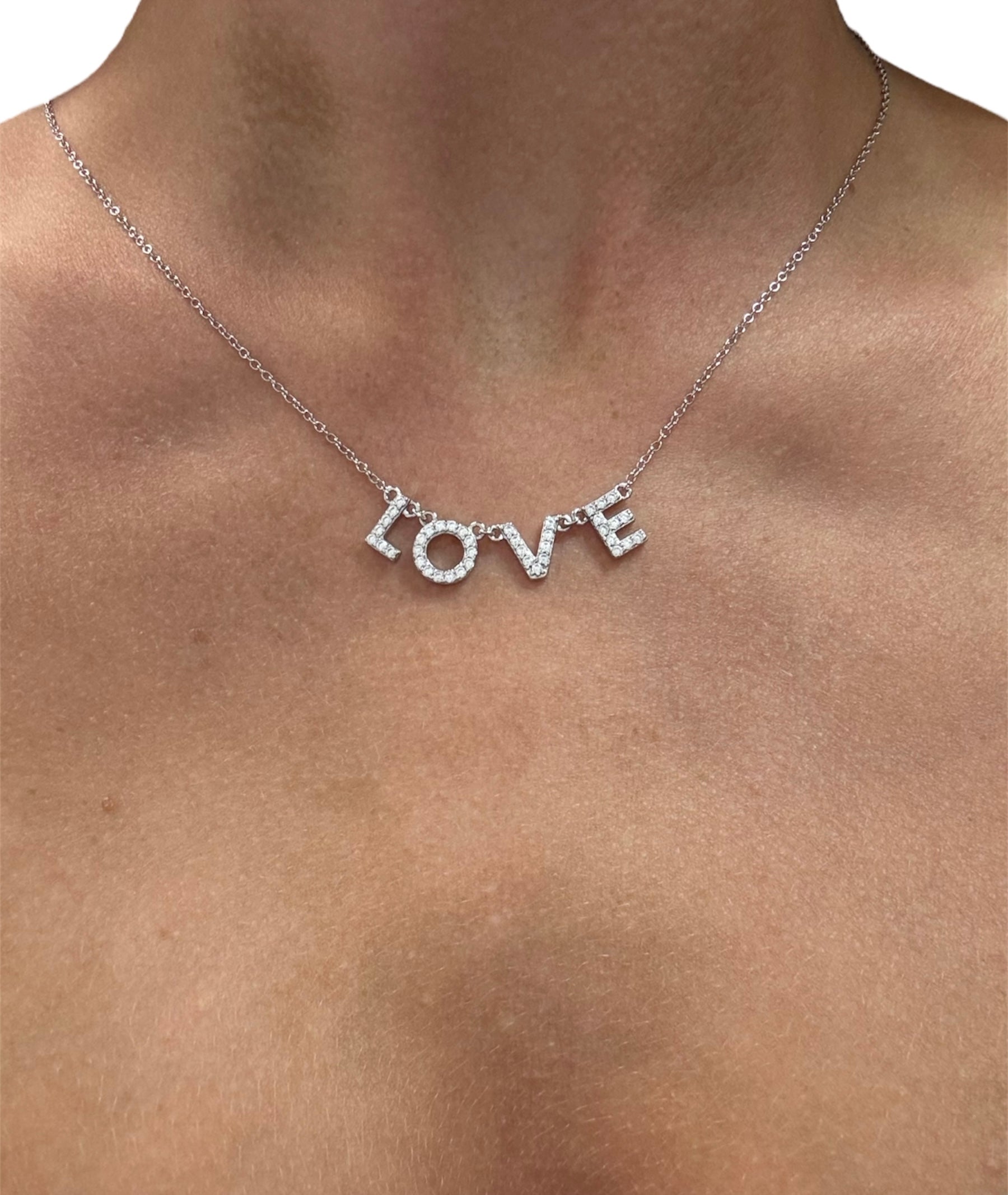 Sterling silver 925 LOVE lettered necklace featuring elegant script design, perfect for personal expression.