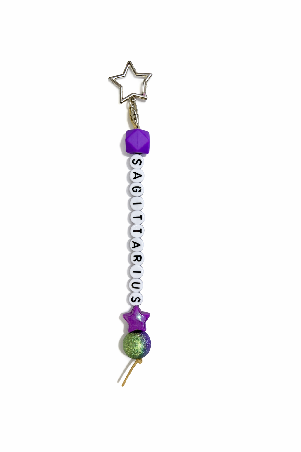 Jules by the Sea Zodiac keychain featuring a celestial design on a metal keychain with zodiac symbols and branding.