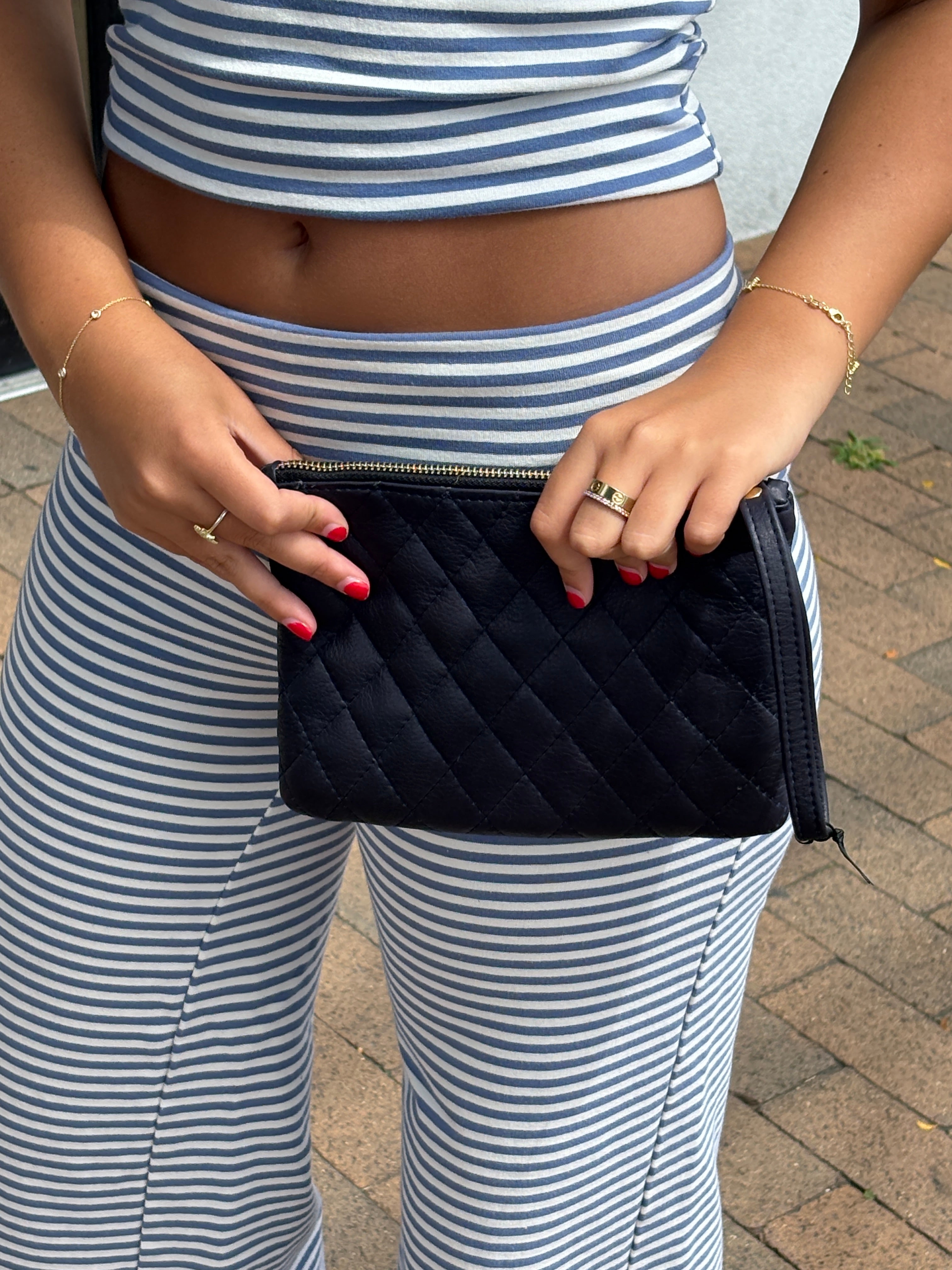 Laggo leather wristlet clutch featuring a stylish design and elegant texture, perfect for any occasion.