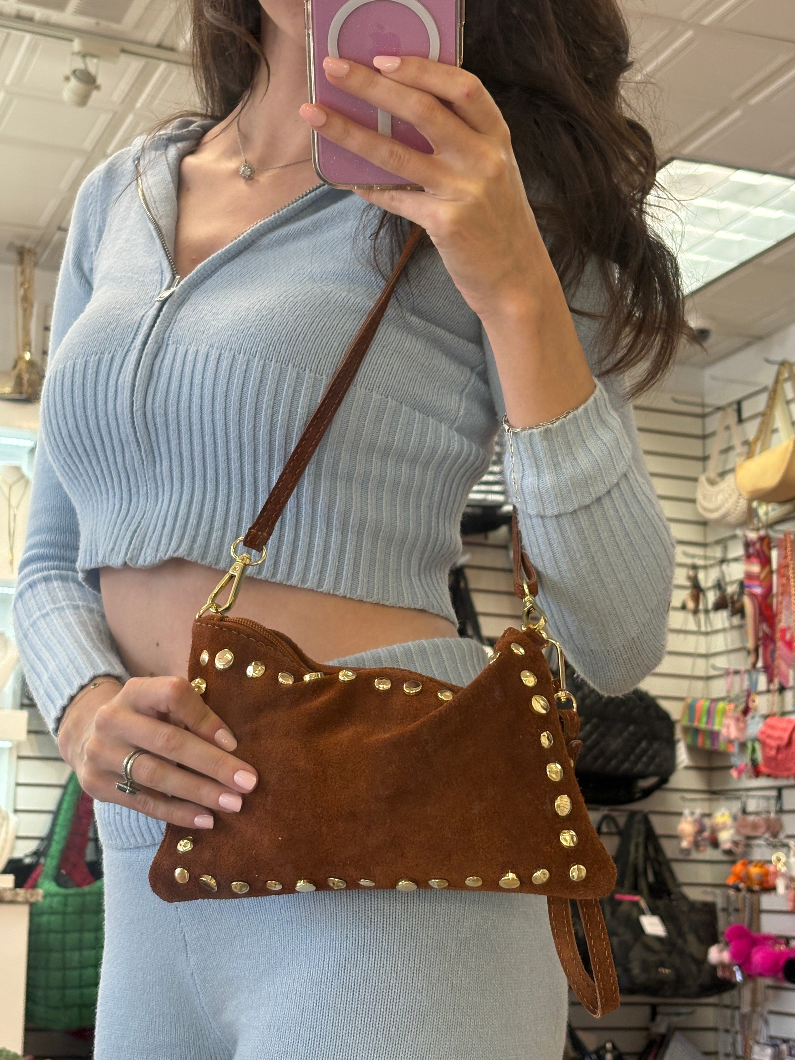 Violet eco suede mix studded crossbody pouchette bag with adjustable strap and stylish design.