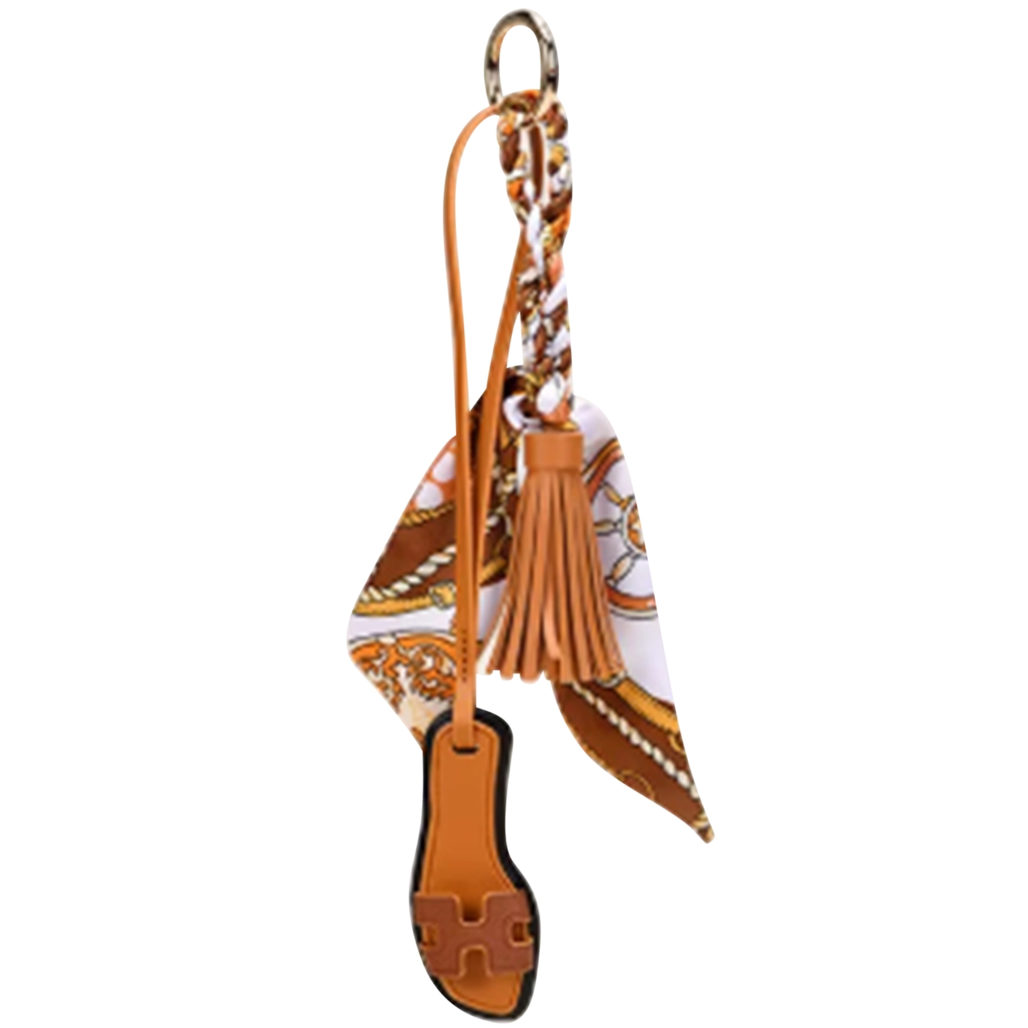 Malibu Sugar sandal with scarf bag charm, featuring decorative charm attached to a stylish footwear accessory.