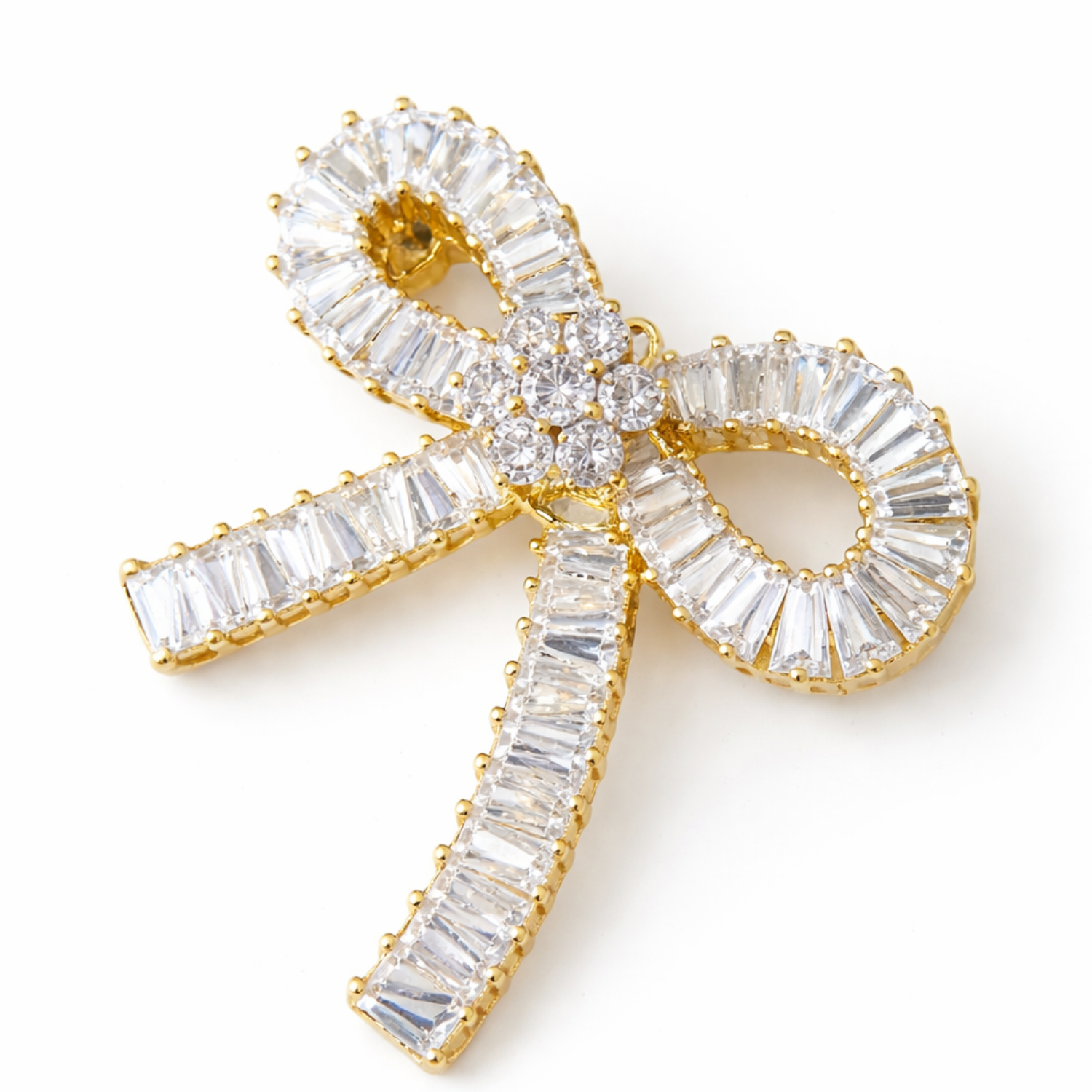 Elegant crystal ribbon bow brooch with sparkling details, featuring a silver-tone pin back, perfect for adding a touch of elegance.