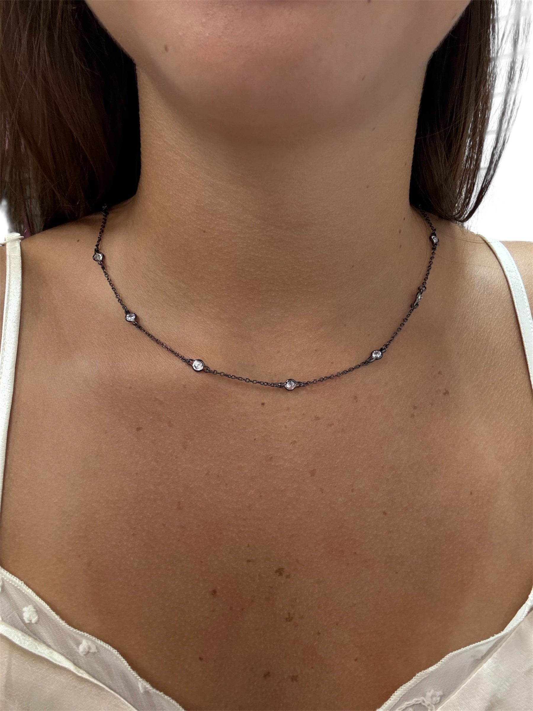 Sterling silver 925 diamond choker necklace with a sleek design, displayed elegantly against a neutral background.