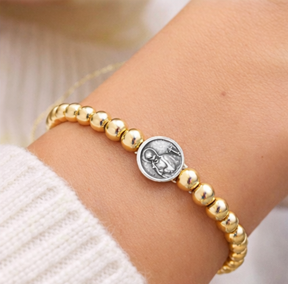 Subliminal Saint Gerard beaded bracelet by love lisa featuring colorful beads and a saint charm.