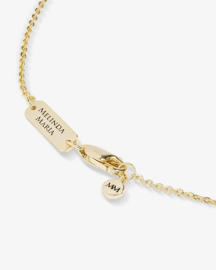 Gold New Beginnings Medallion Necklace by Melinda Maria featuring white diamondette accents on a delicate chain.