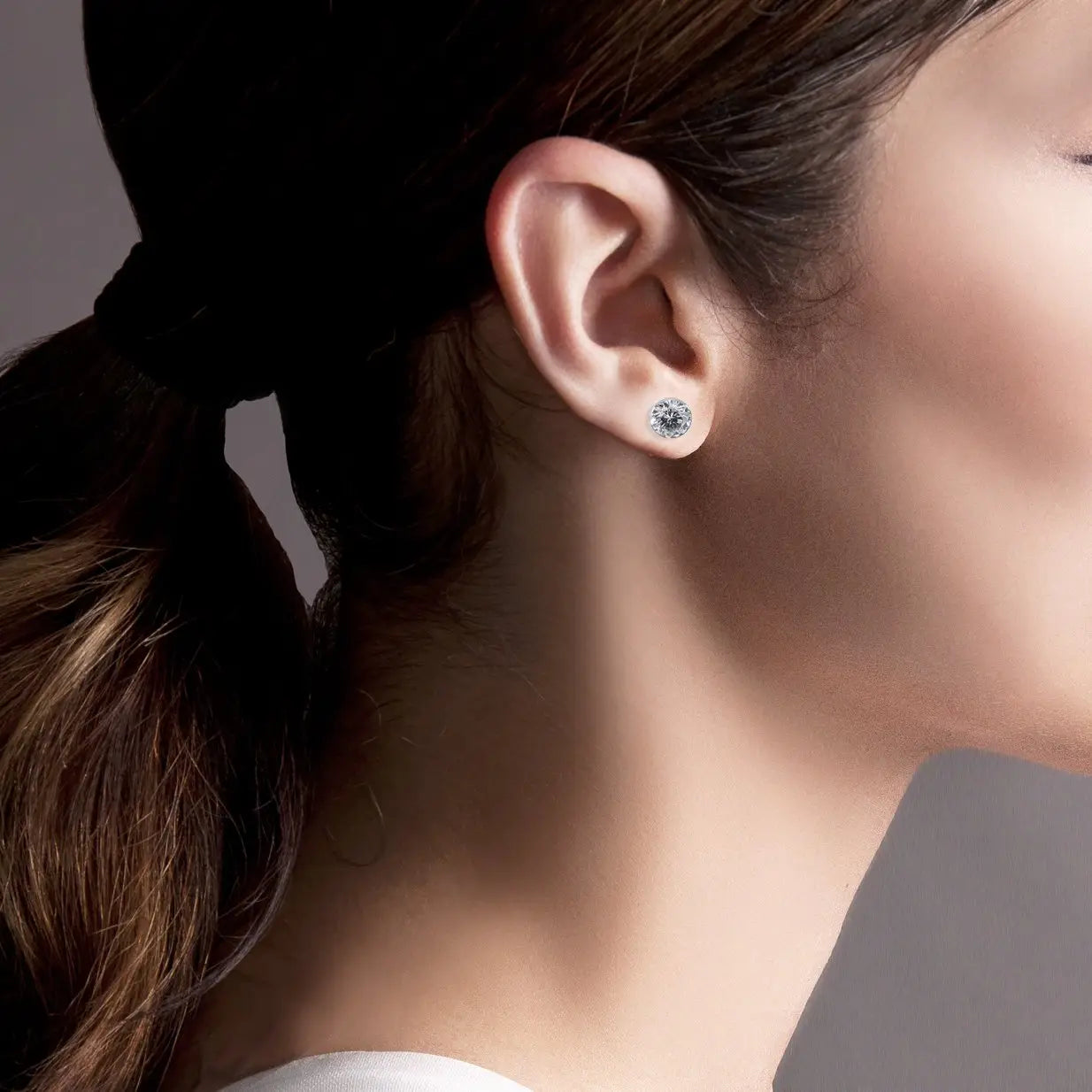Elegant B.Tiff solitaire stud earrings featuring sparkling gemstone set in classic metal for a timeless jewelry look.