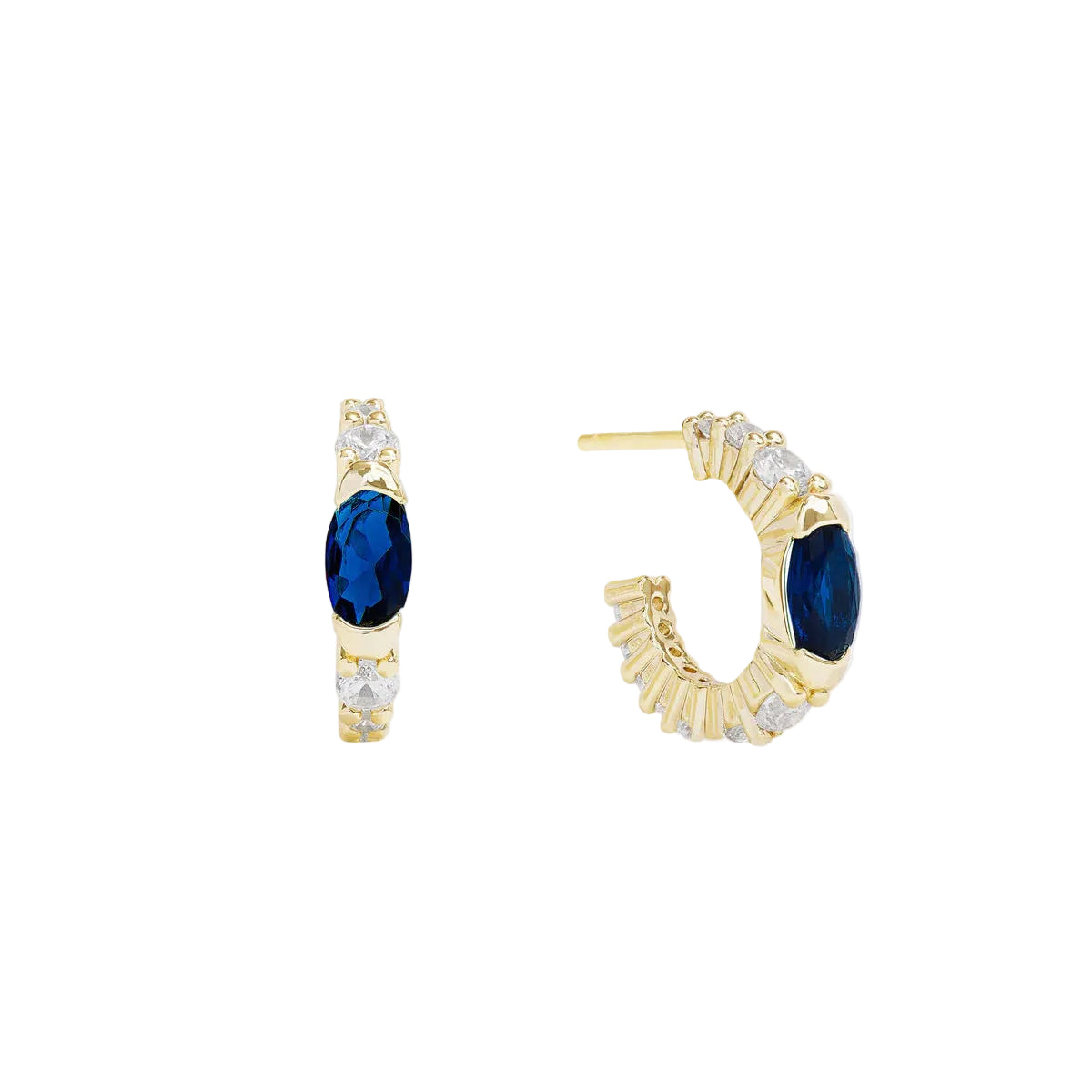 Gold Melinda Maria The Maven Huggies earrings with a sleek, minimalist hoop design on a plain background