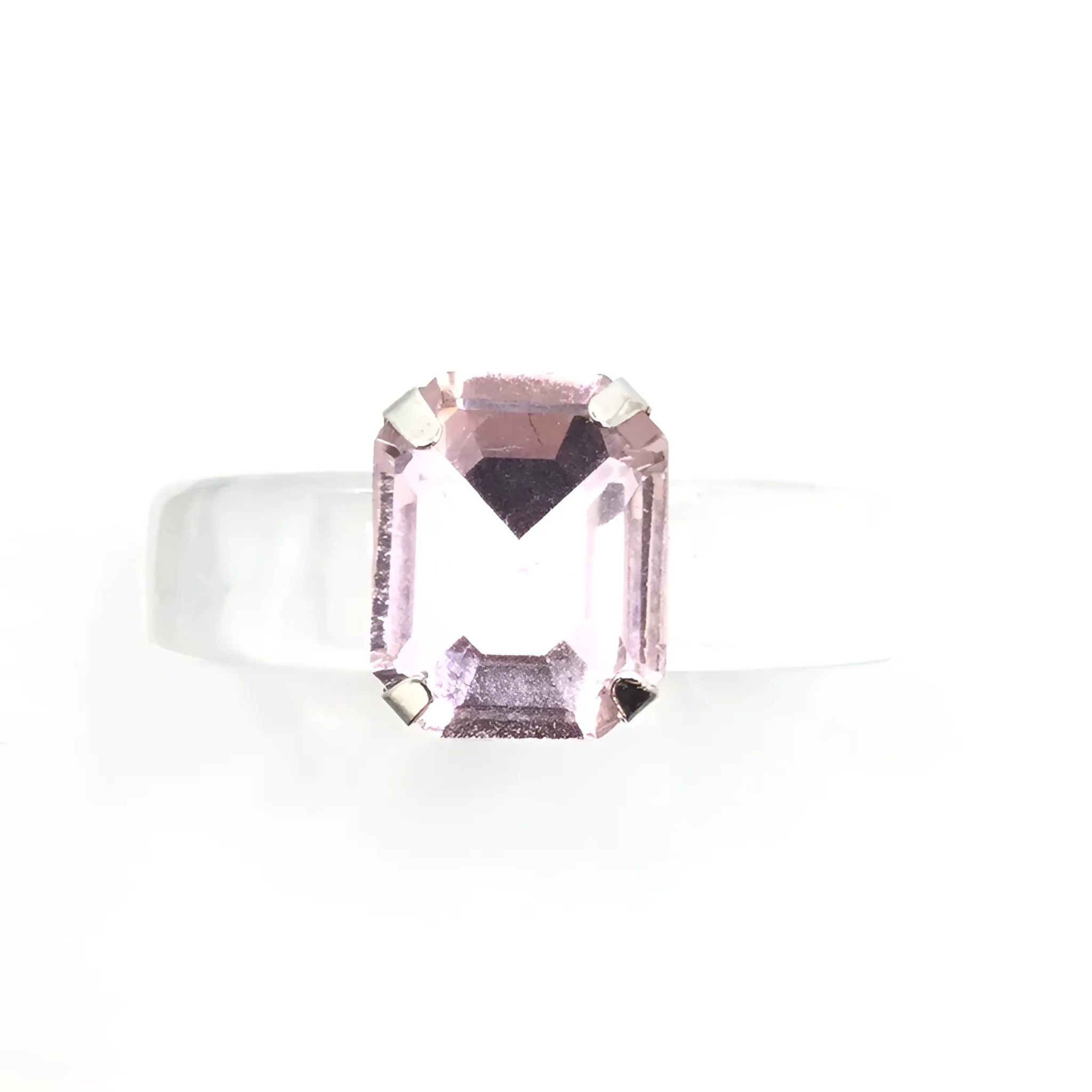 Elegant Private Label Rosie ring featuring a delicate design and shimmering details, set against a neutral background.