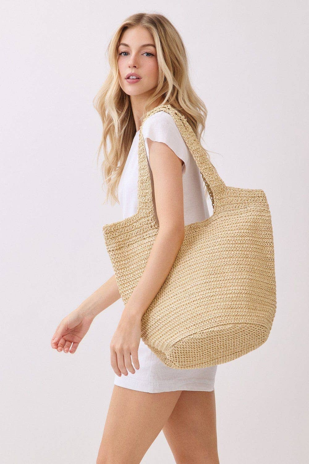 Shannon handmade straw tote bag featuring a stylish woven design, perfect for casual outings and everyday use.