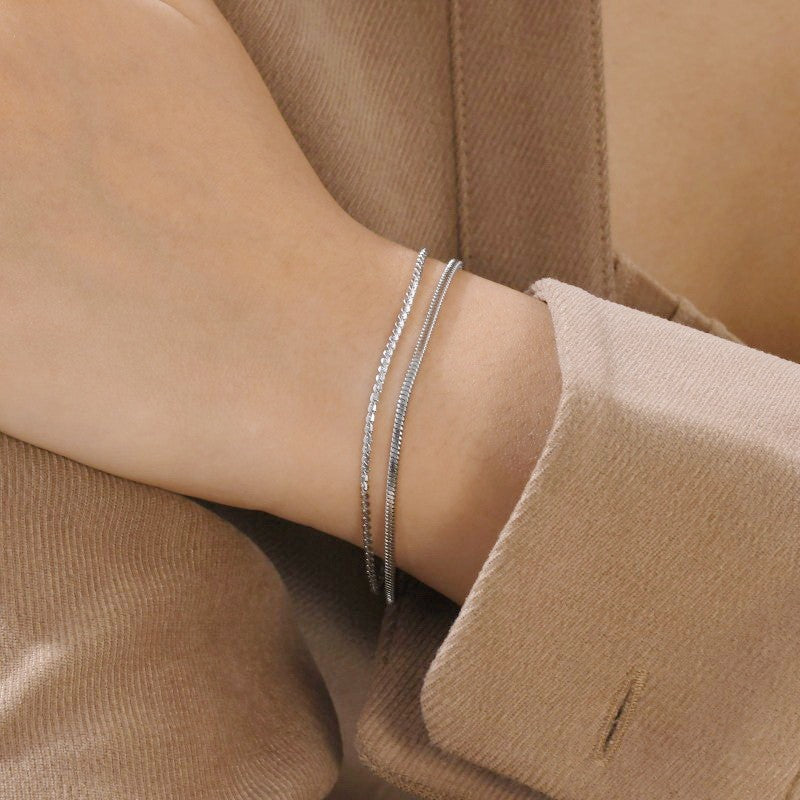 Stainless steel layered bracelet by Private Label Jewelry, showcasing a tarnish-free design with elegant stacking style.