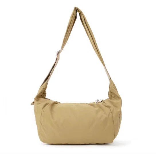 Khaki Cana Crescent Crossbody by prenelove featuring a curved design and adjustable strap for versatile styling.