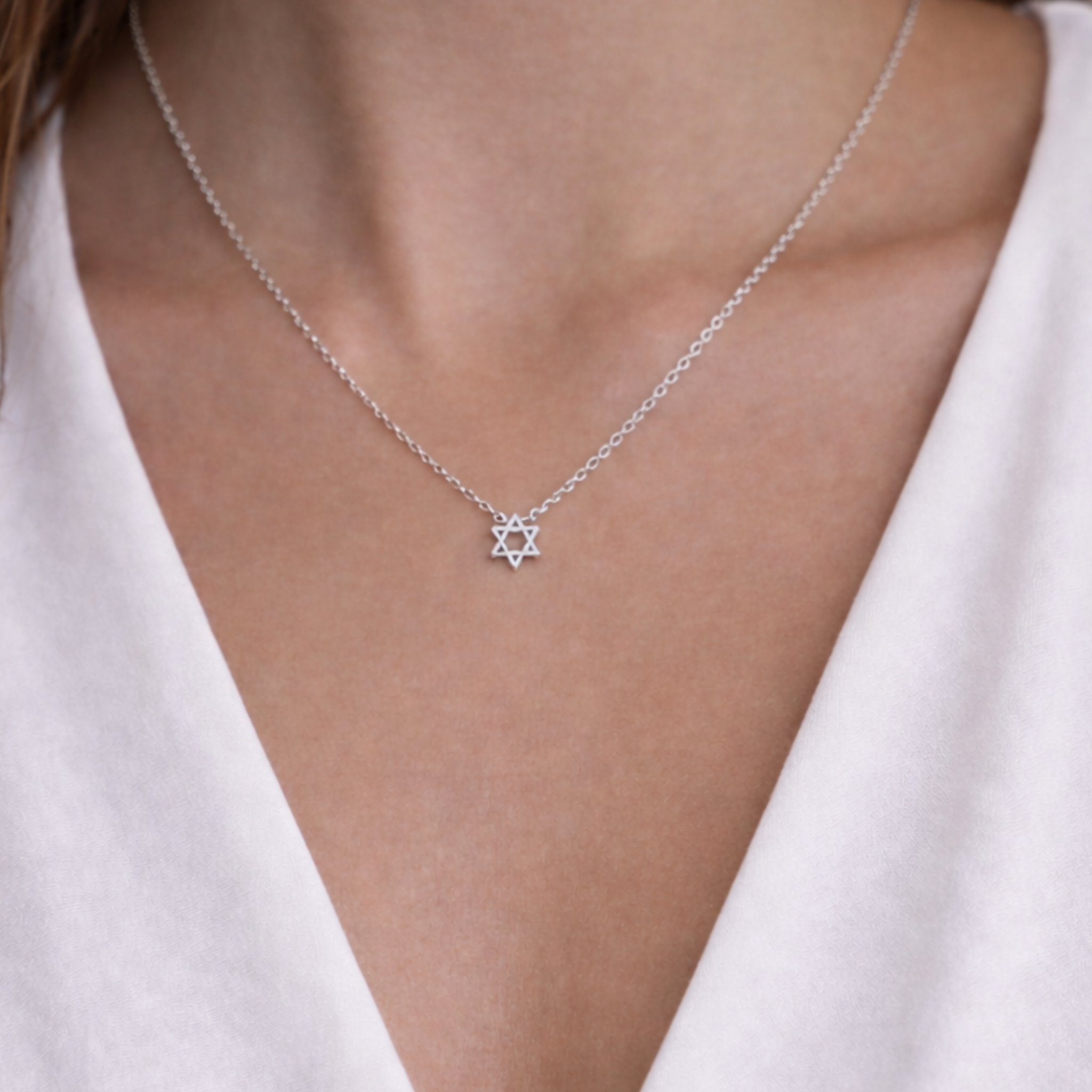 Baby Star of David necklace with a delicate chain and small pendant, designed by Private Label, perfect for children or as a meaningful gift.