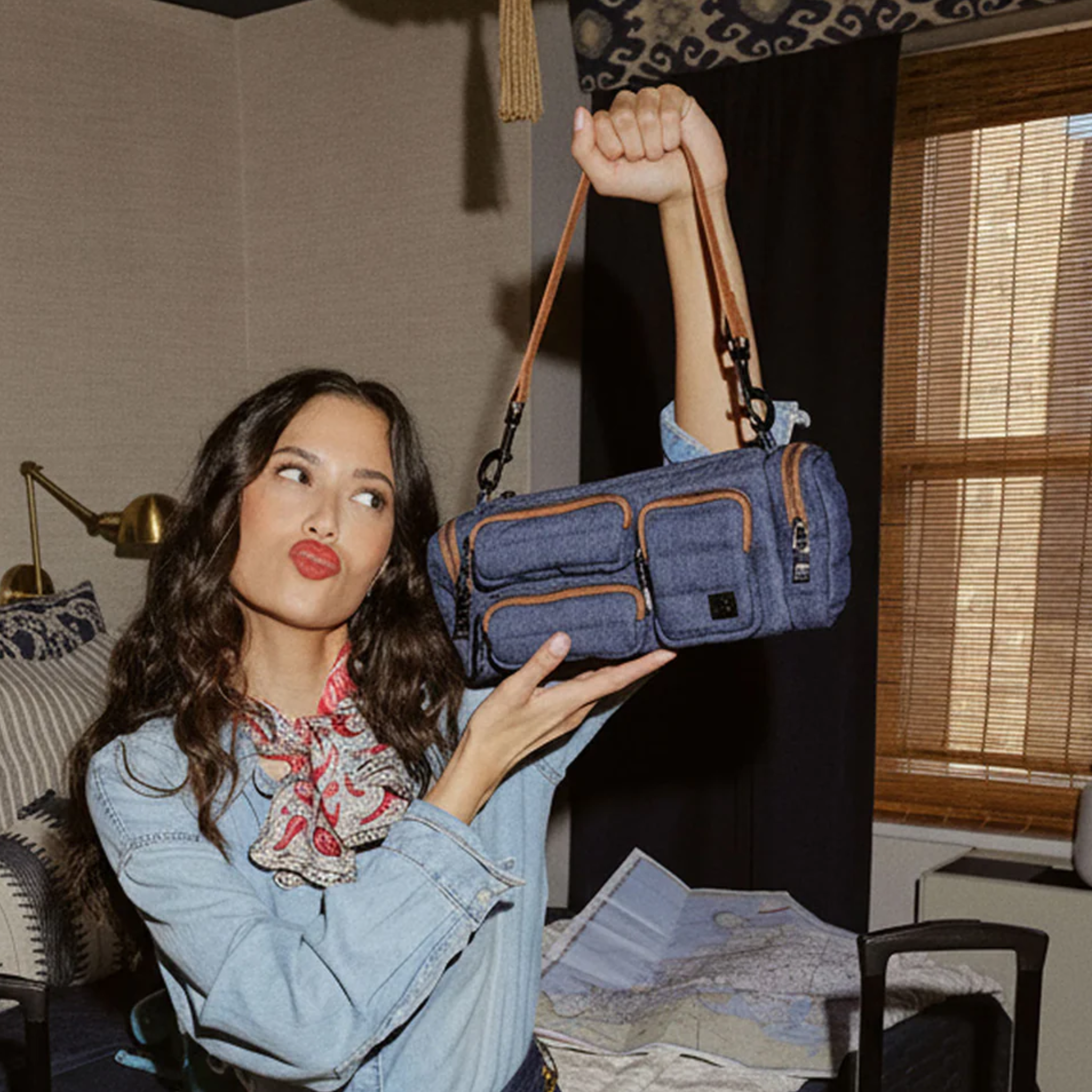 Think Royln Lady Cargo shoulder bag with coquette heart and bow bag charm, stylish accessory in a compact design.