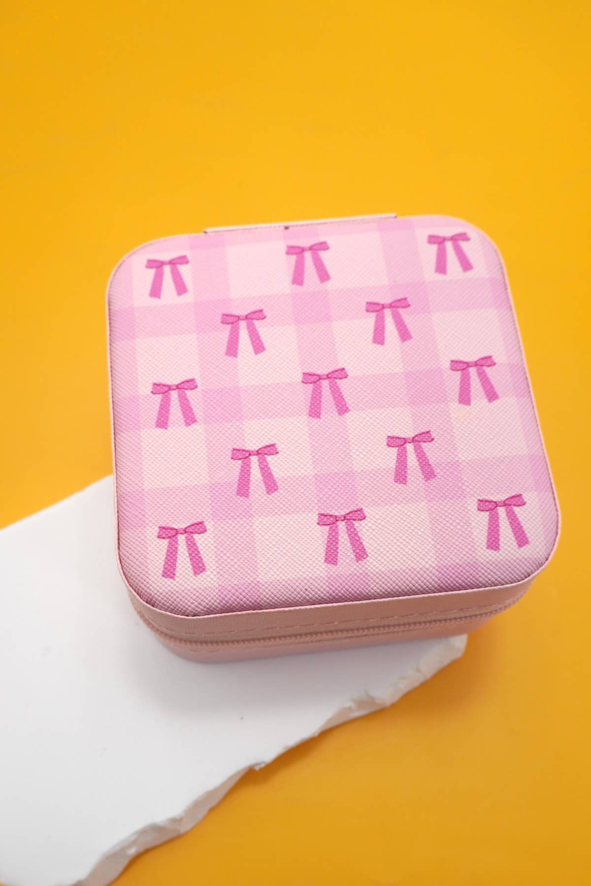 Private label Coquette jewelry organizer travel pouch with compartments for jewelry storage and secure closure.