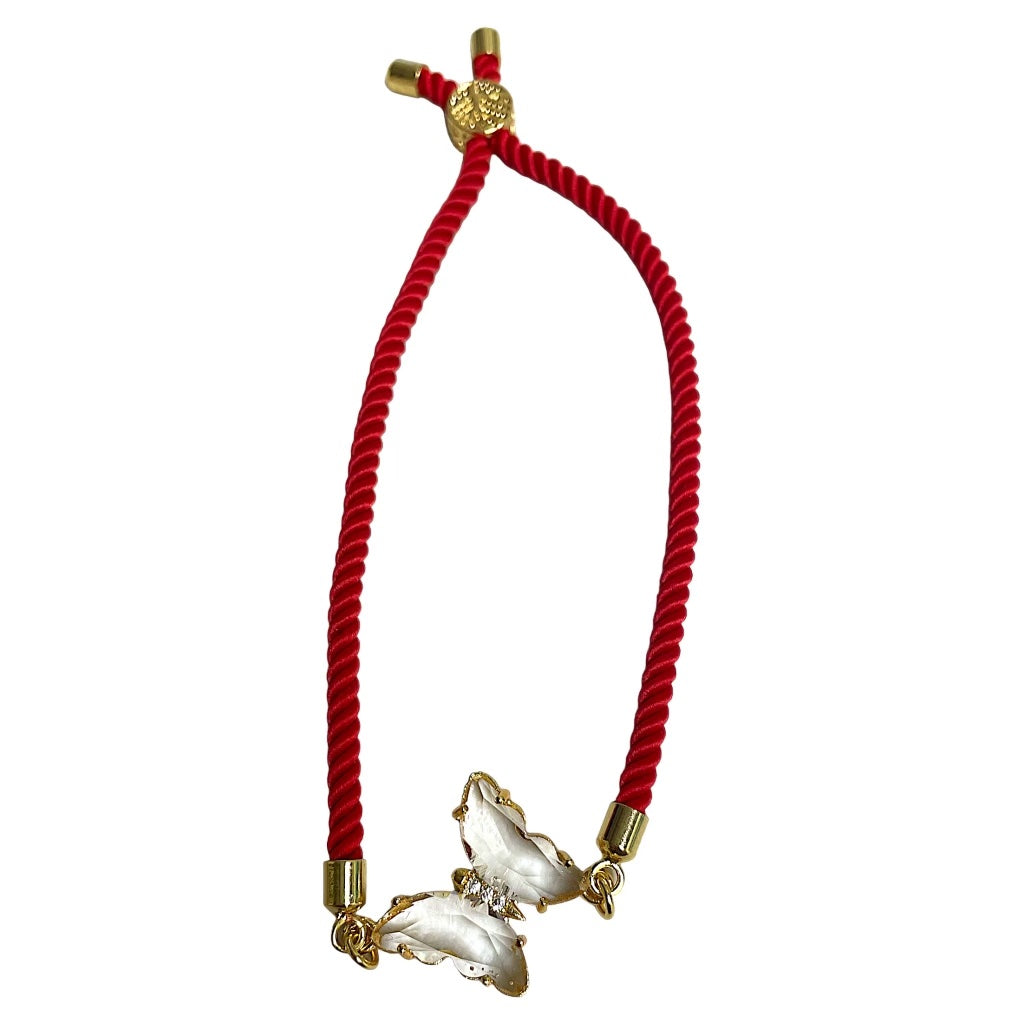 Red rope pulley bracelet by Brenda Perruzza Jewelry with clear bead accents, featuring a stylish and adjustable design.