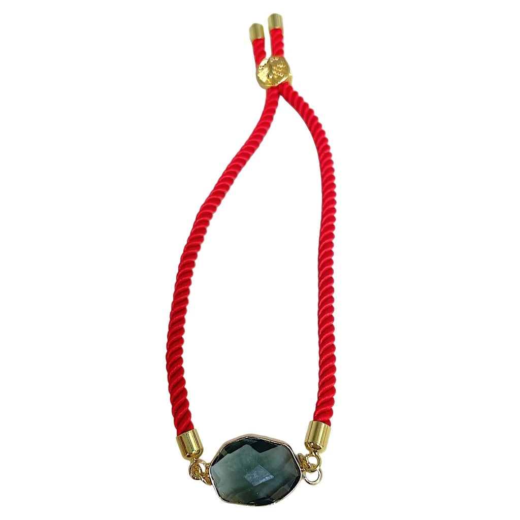 Red and grey rope pulley bracelet by Brenda Perruzza Jewelry featuring woven cord and adjustable design.