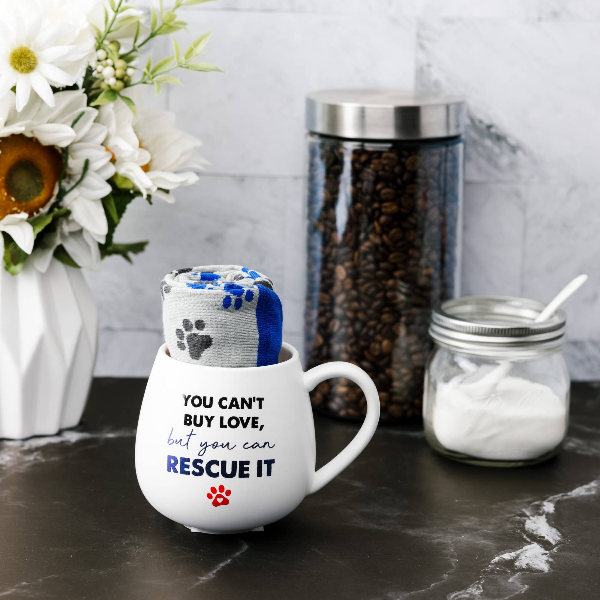 Pavilion 15.5 oz mug and cozy socks set featuring a comforting design, perfect for warm beverages and relaxation.