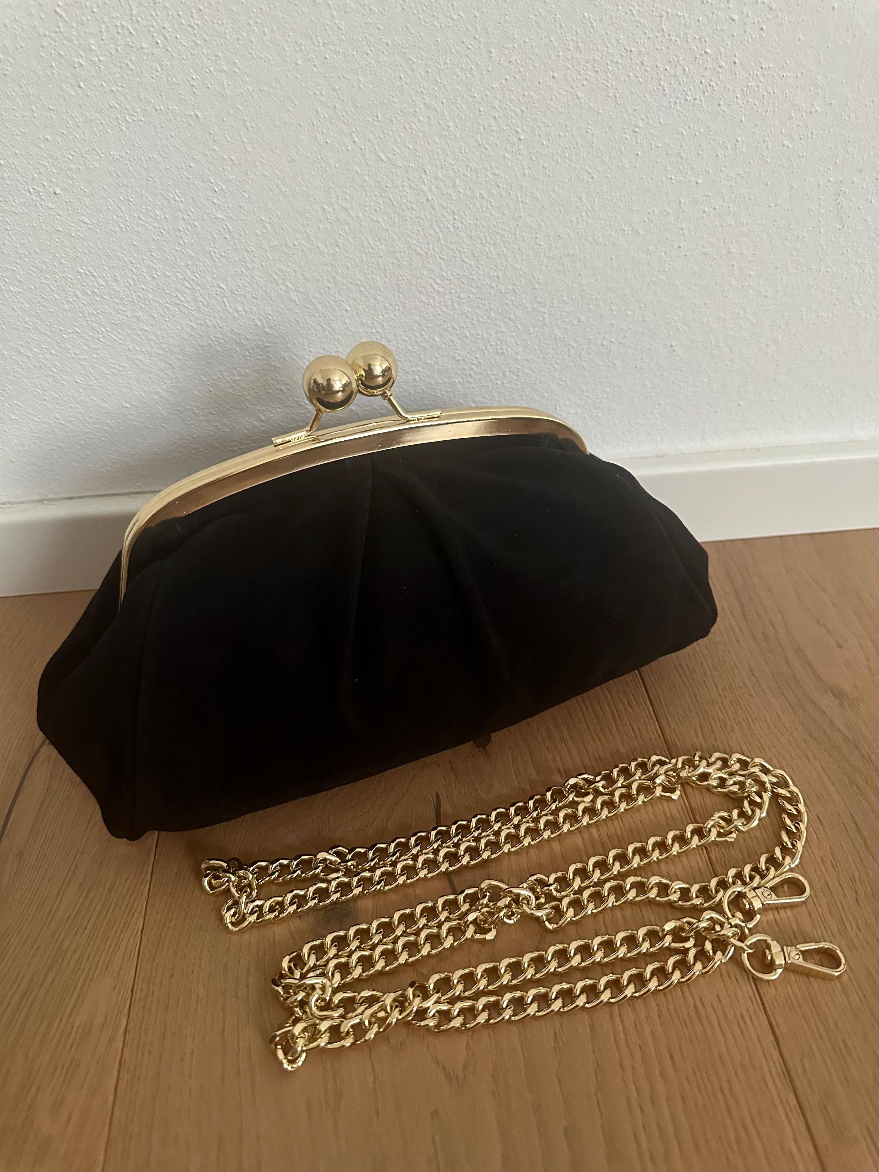 Private label frame suede clutch bag with sleek design and minimalist style, featuring a structured rectangular shape.