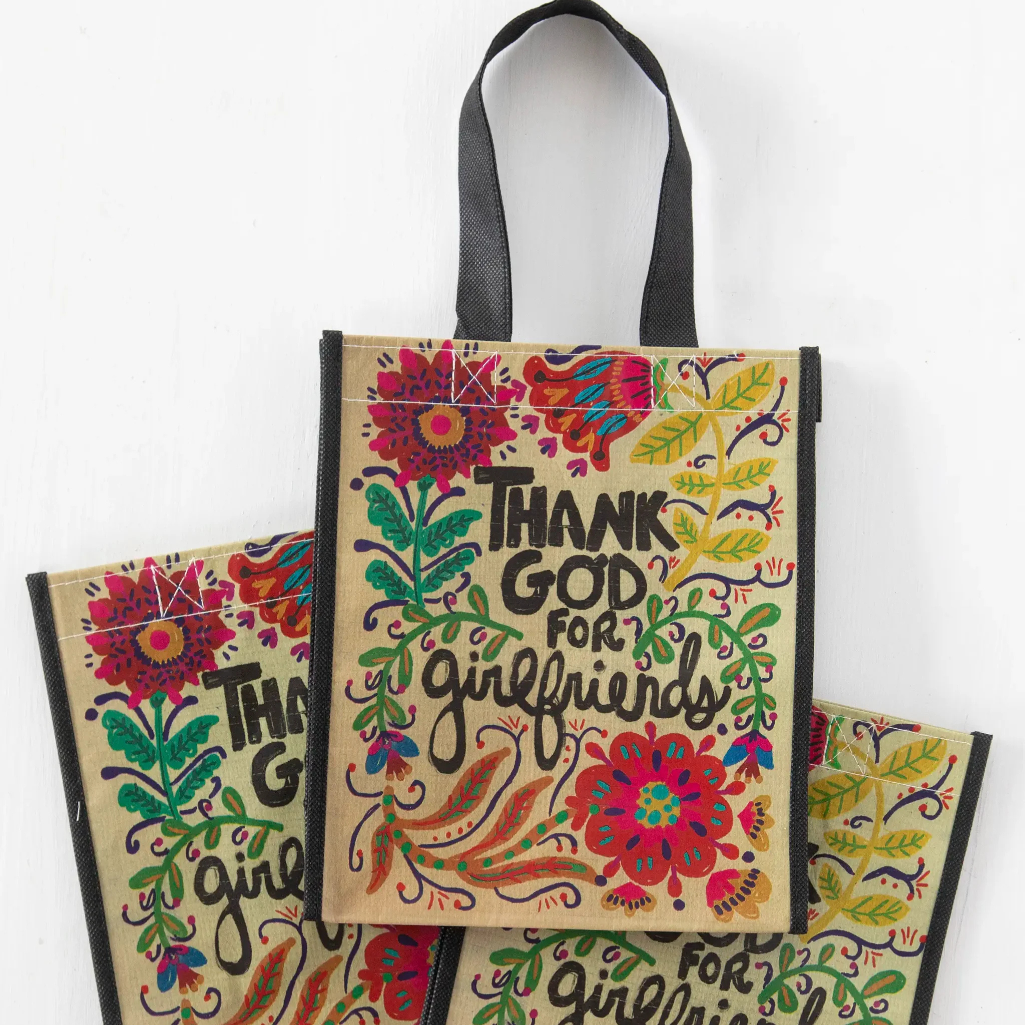 Set of three Natural Life medium tote bags with colorful happy face designs, perfect for casual carrying and everyday use.