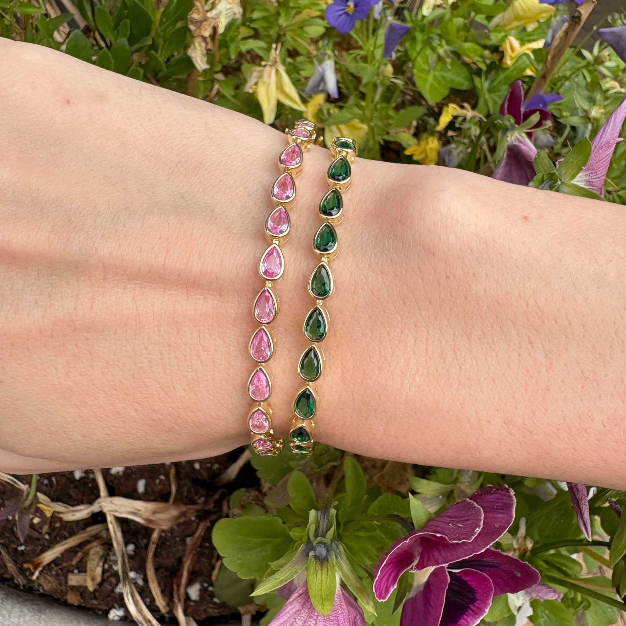Colorful pear-shaped sterling silver tennis bracelet with vibrant gemstone accents, designed by Private Label Jewelry.
