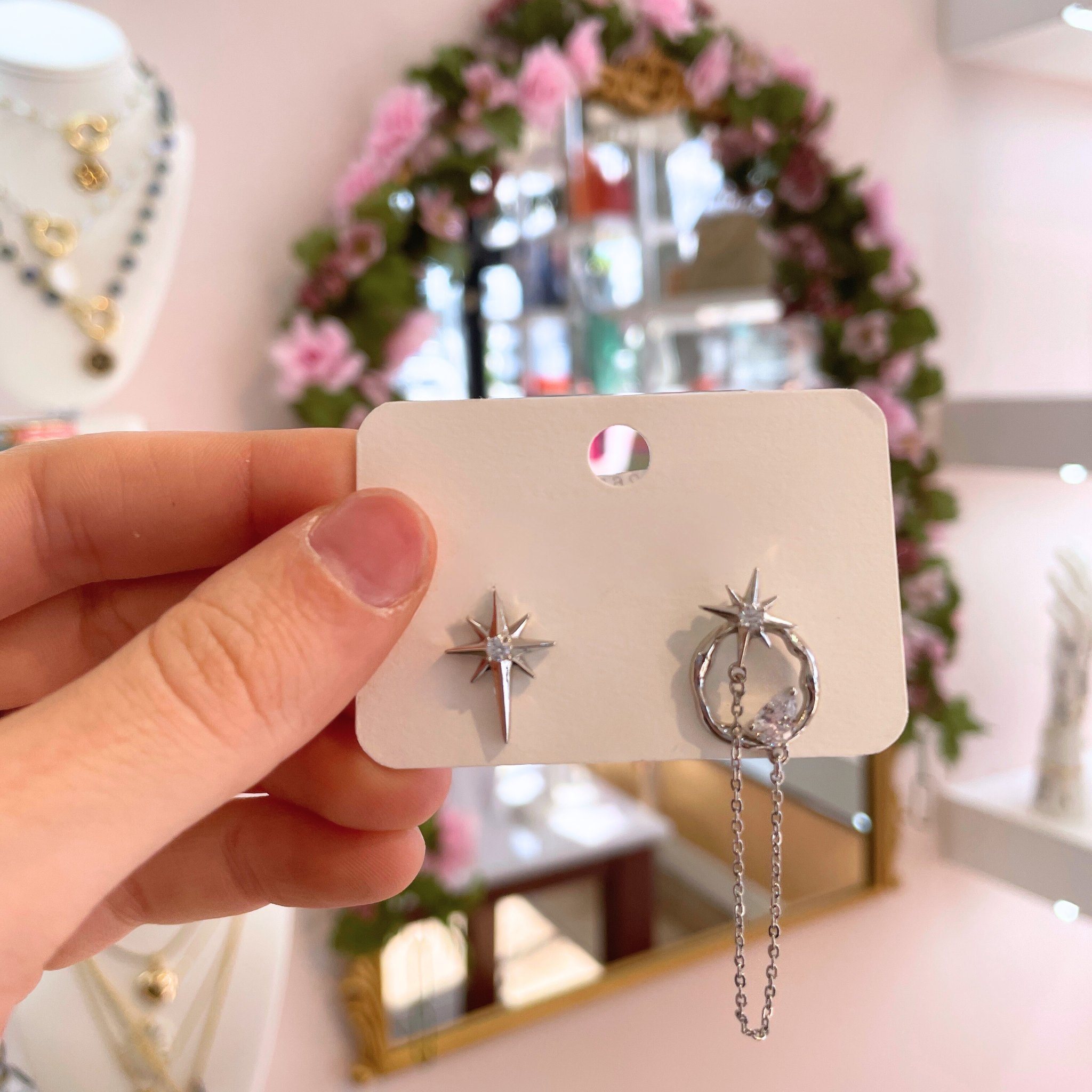 Celestial Starburst Chain Studs earrings featuring a unique starburst design and delicate chain detailing.