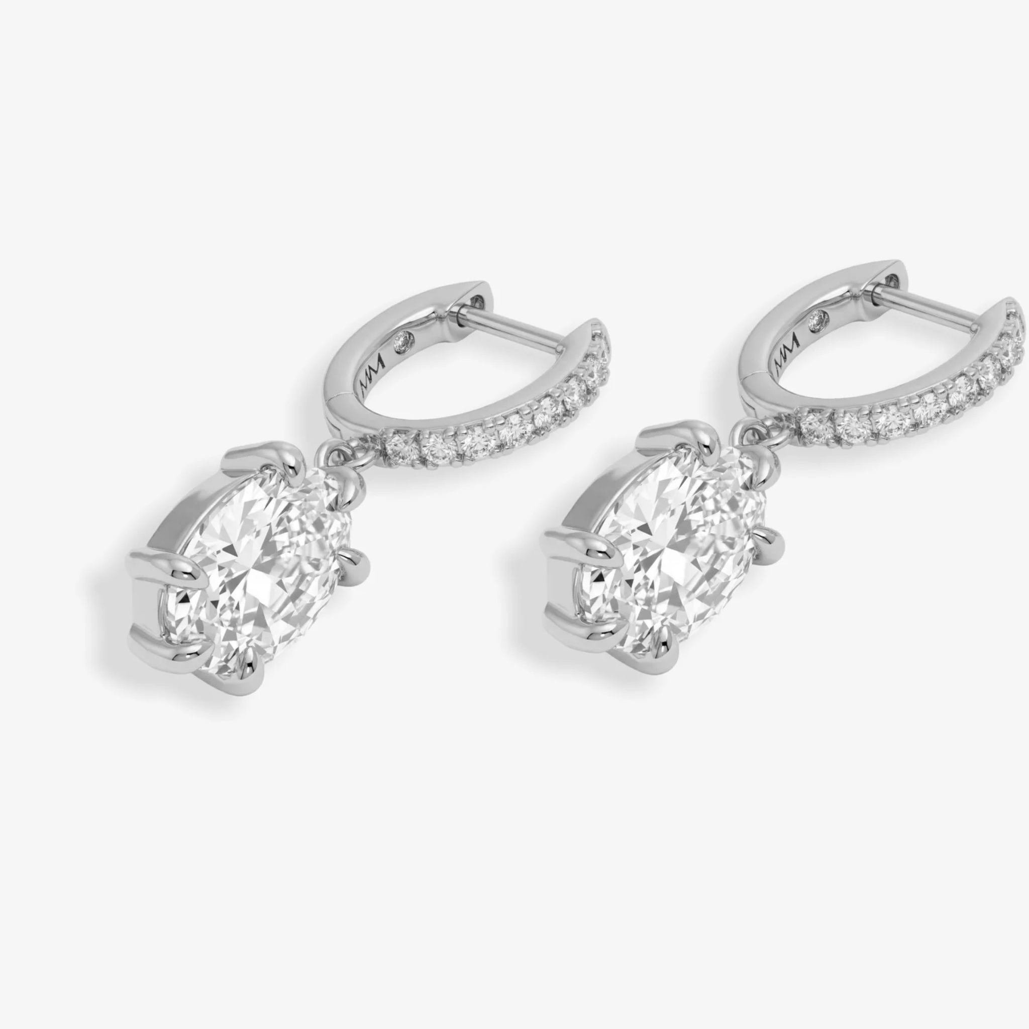 Silver She's On Point earrings by Melinda Maria featuring white diamondette accents and a stylish, modern design.