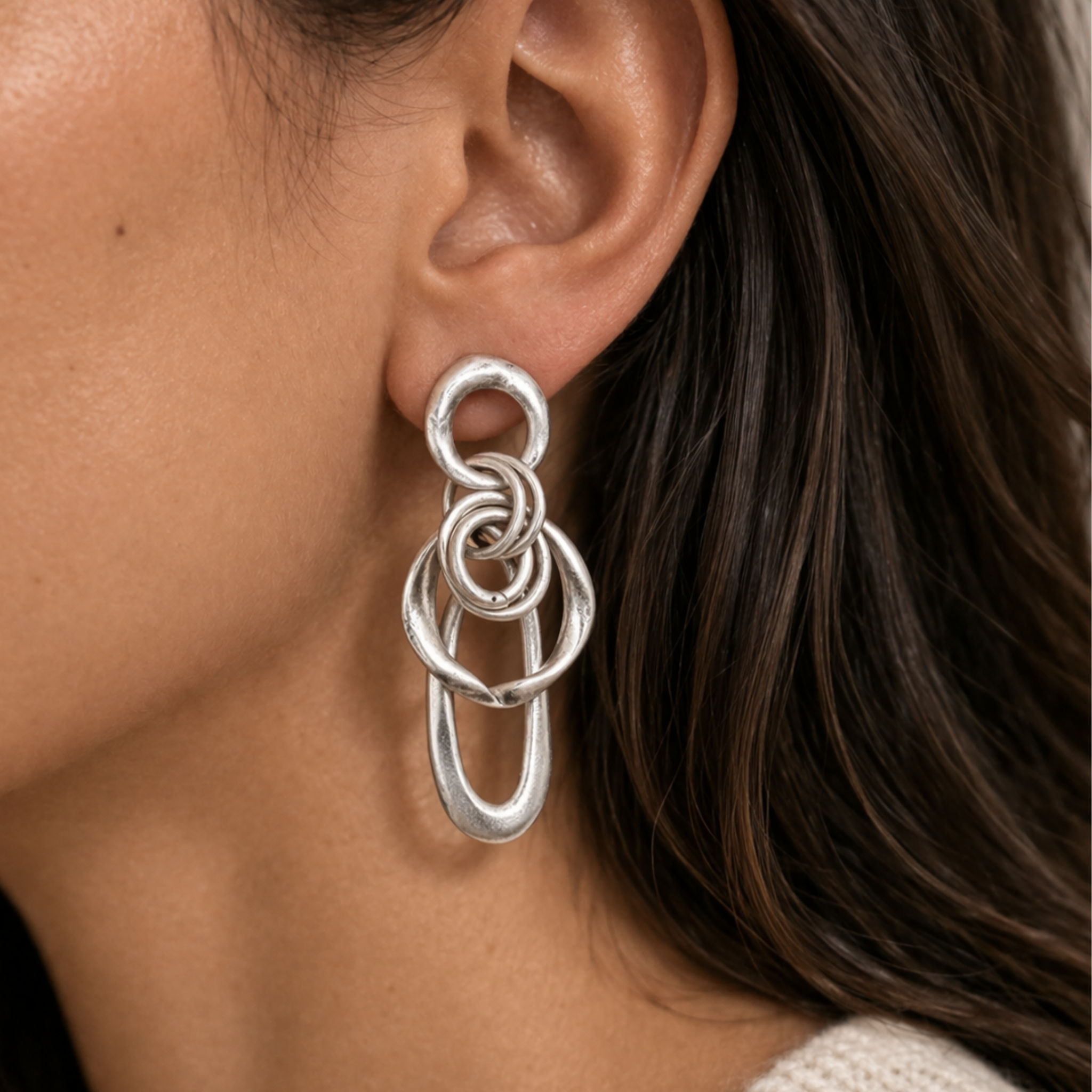 Handmade abstract pewter earrings by Chanour featuring unique, artistic design and textured surface.