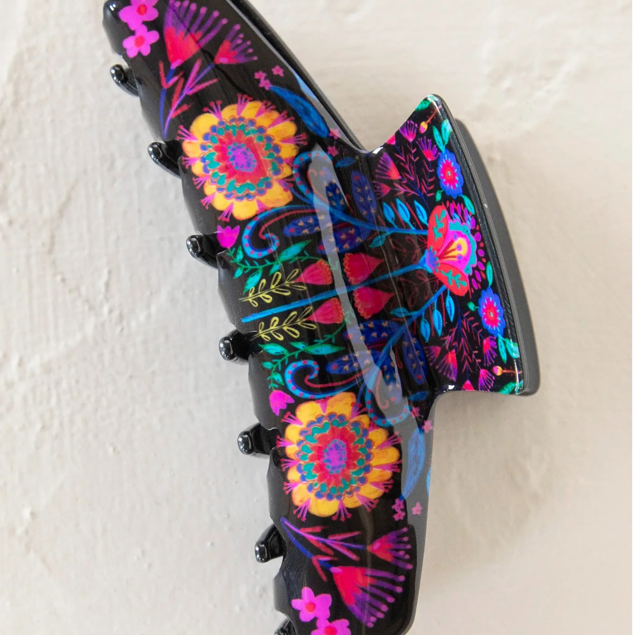 Natural Life black folk flower hair clip featuring a stylish claw design for everyday wear.