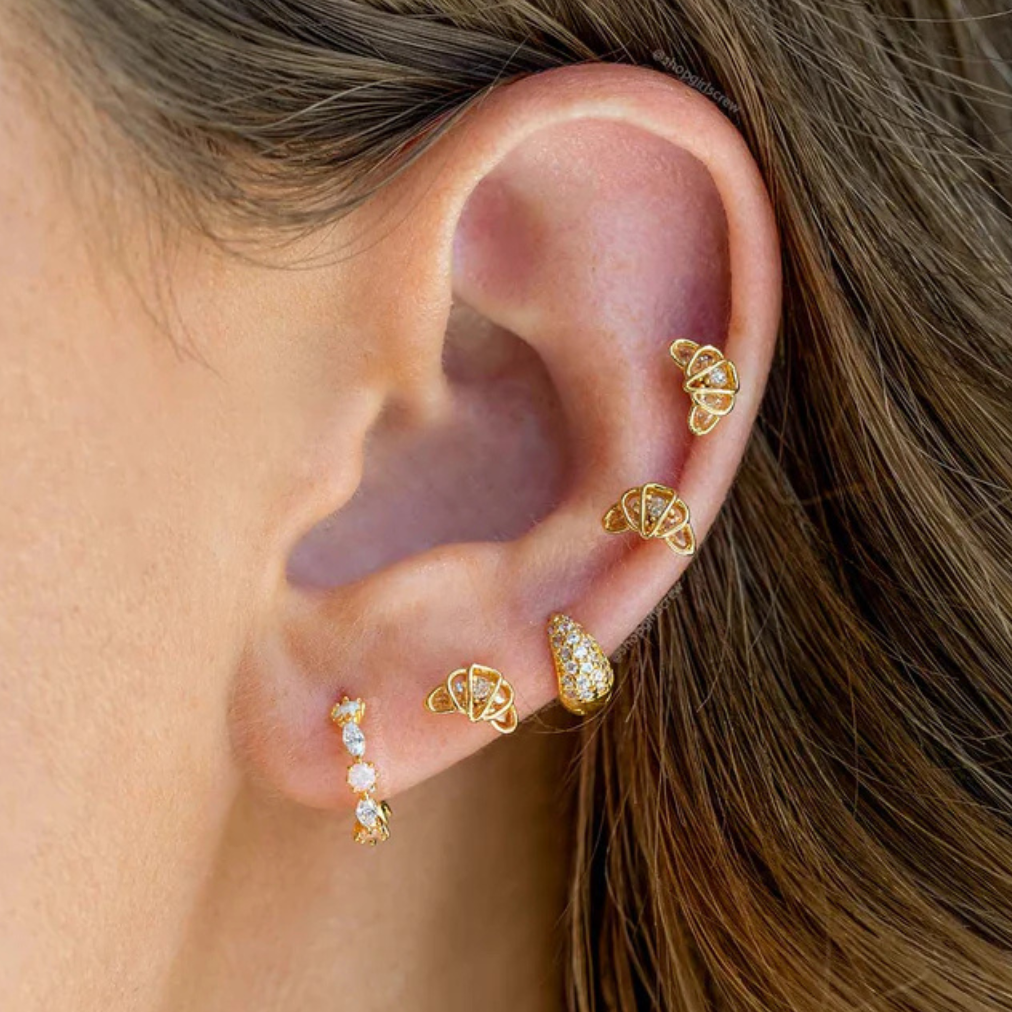Girls Crew croissant studs earrings in gold, featuring a textured, curved design that resembles a classic croissant.