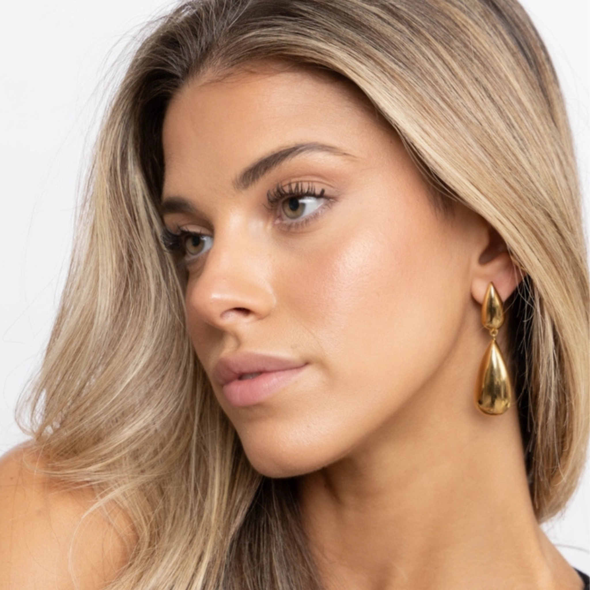 Silver Gia Drop Earring by Sahira Jewelry Design featuring a delicate teardrop shape with intricate detailing.
