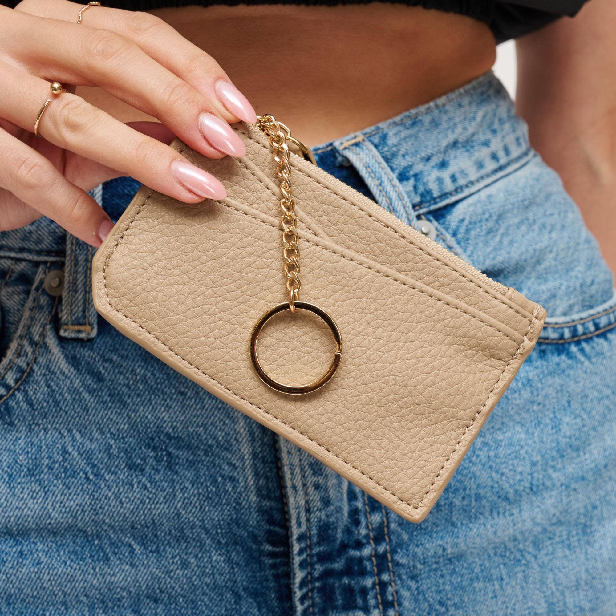 Urban Expressions Adriana card holder, compact wallet accessory with multiple card slots and sleek design, shown in close-up image.