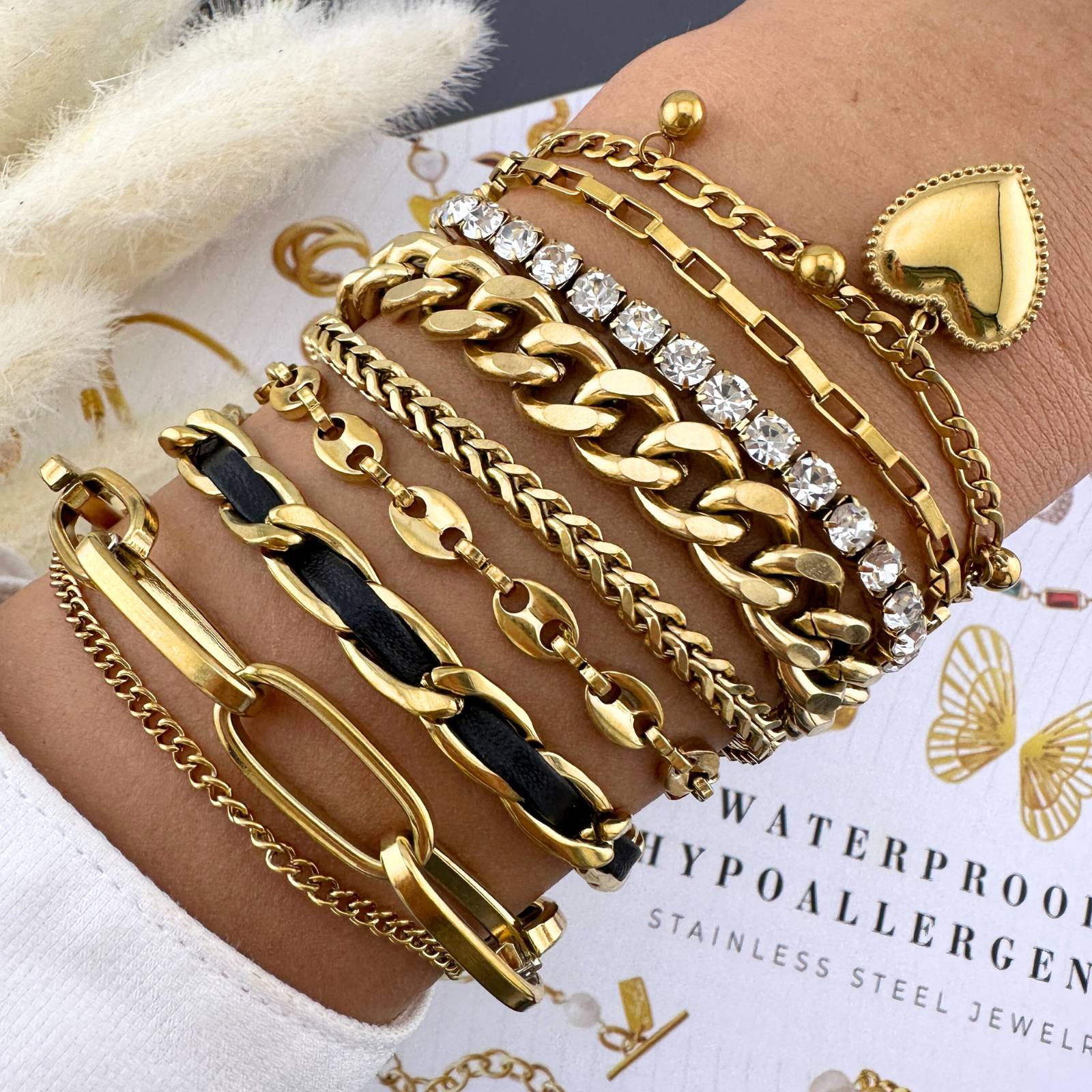 18K gold plated steel Link Bit bracelet with interlocking design and smooth finish on a white background.