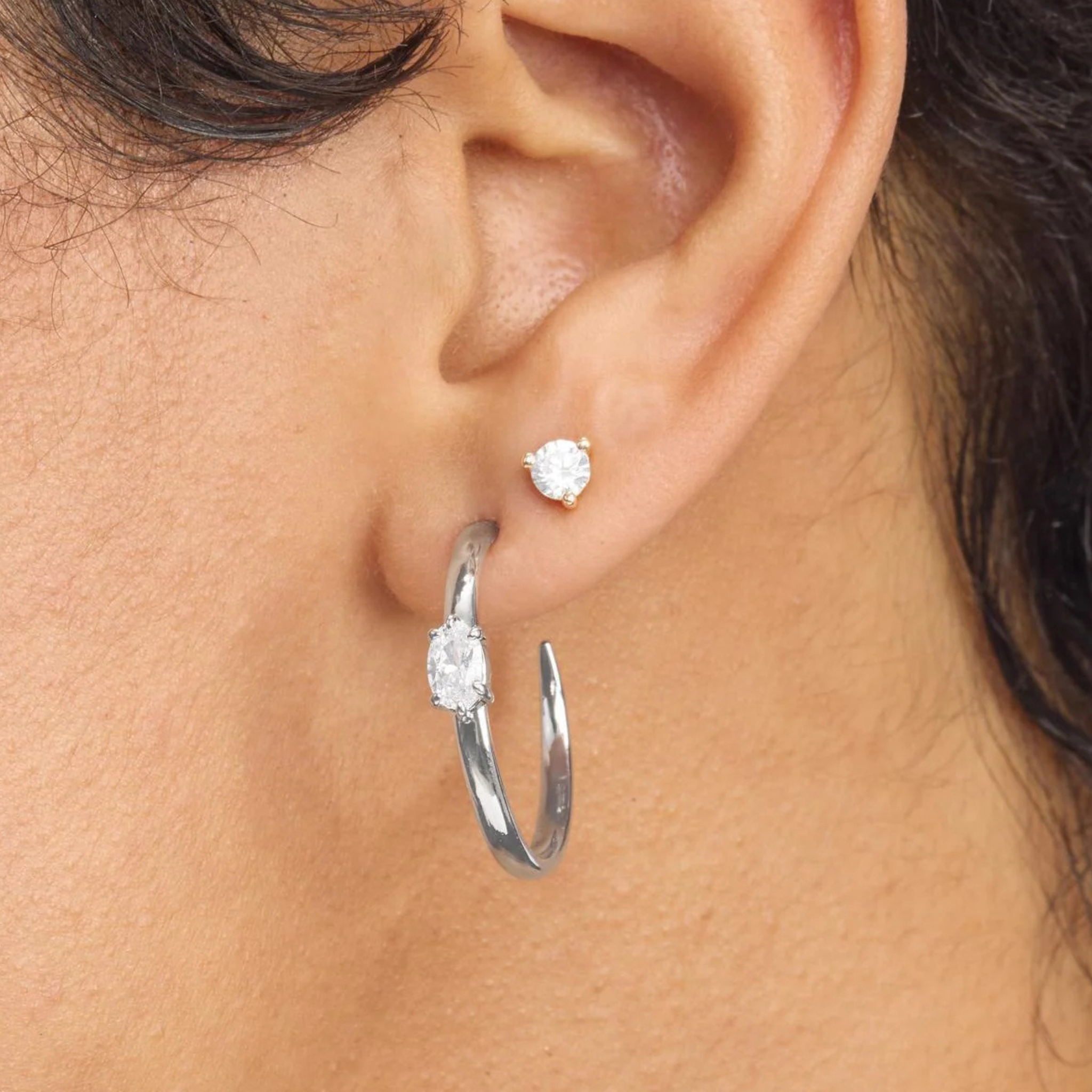 Silver 1-inch She's on Point Hoops earrings by Melinda Maria featuring white diamondette accents on polished hoops.