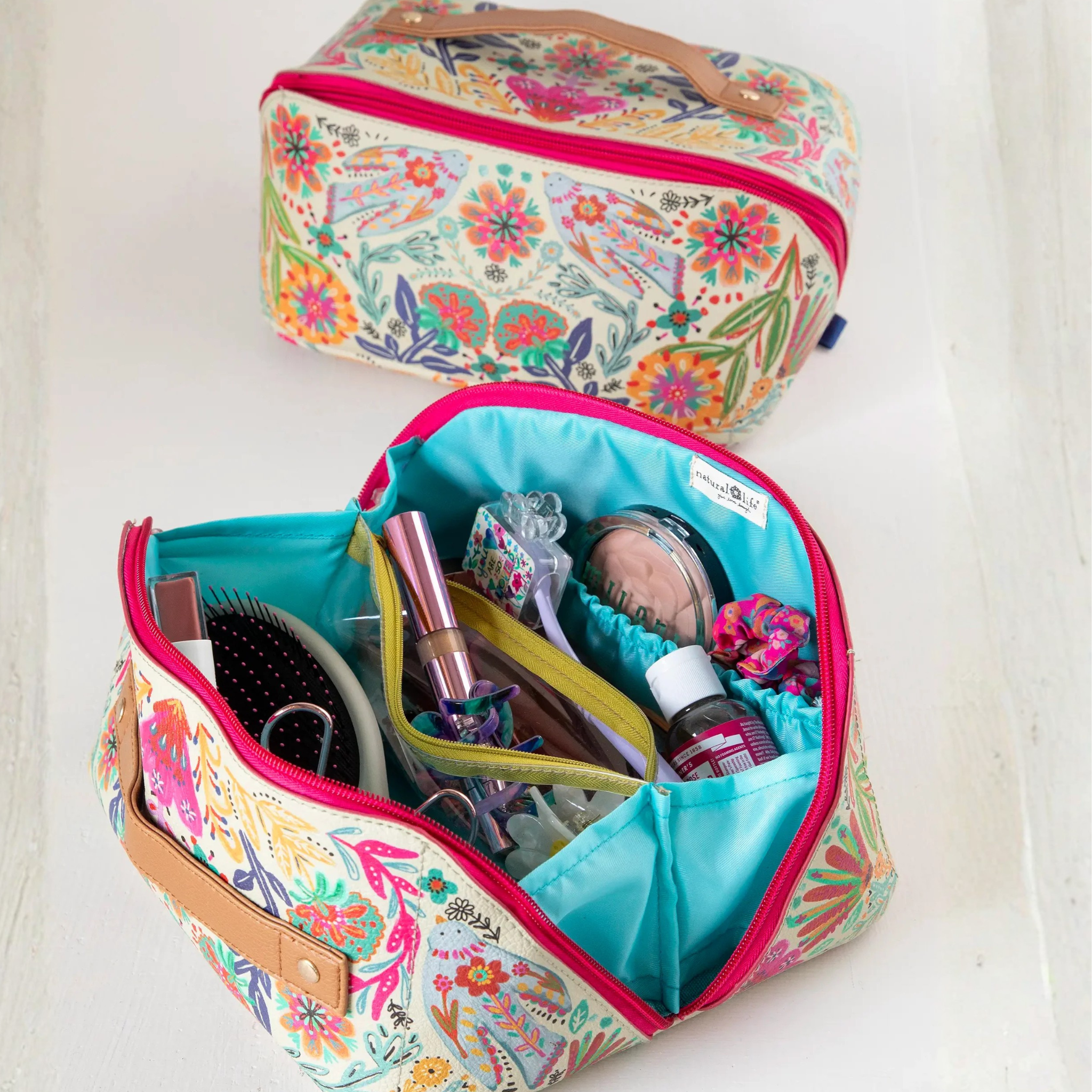 Cream folk flower travel cosmetic organizer pouch by Natural Life with floral pattern and multiple compartments.