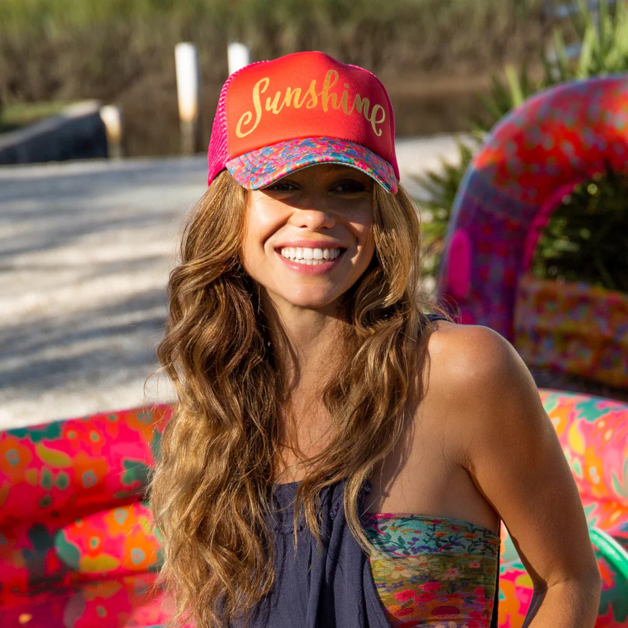 Adjustable Natural Life trucker hat in a bright sunshine color with a classic mesh back design.