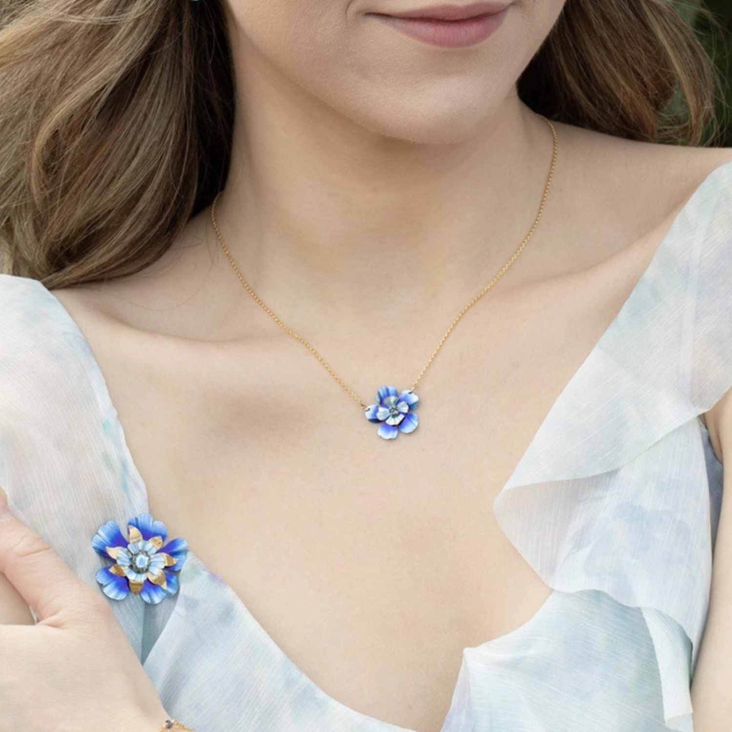 Holly Yashi Blissful Bloom pendant necklace featuring a colorful floral design on a silver chain.