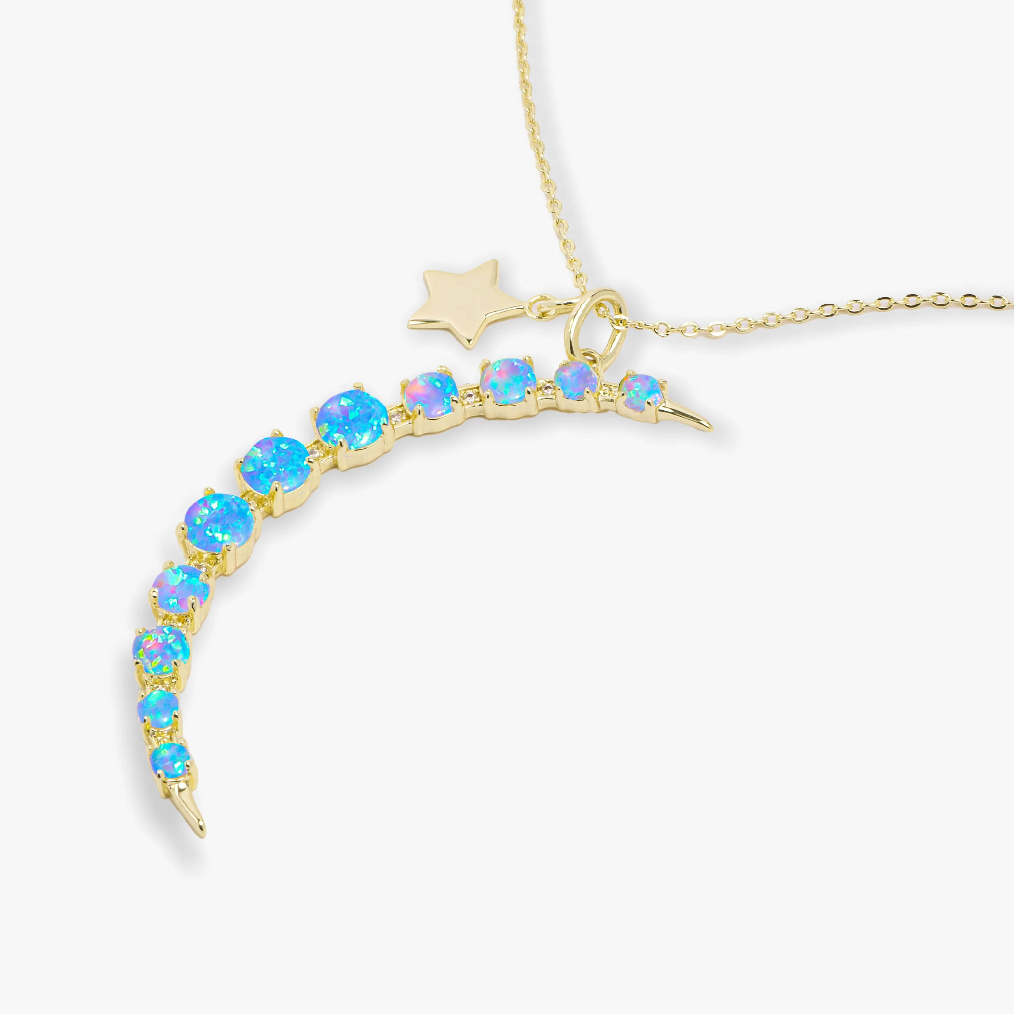 Gold "What Dreams are Made of" necklace by Melinda Maria featuring a blue opal pendant on a delicate chain.
