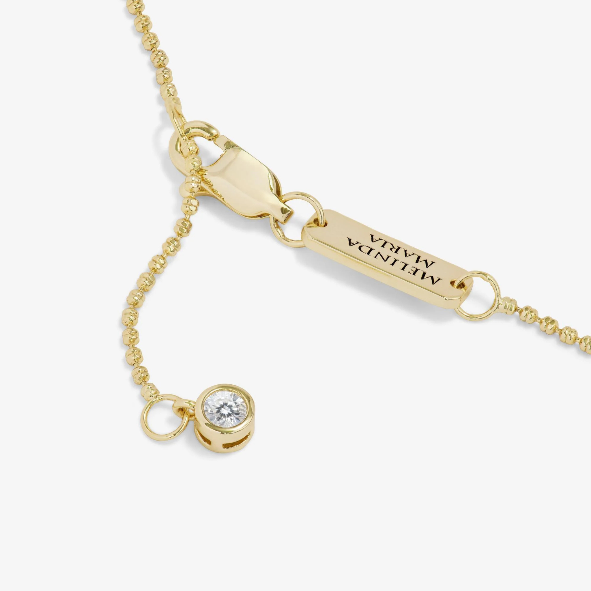 Melinda Maria Ashley Venice Necklace in gold with white diamondette accents, showcasing a delicate chain and elegant design.
