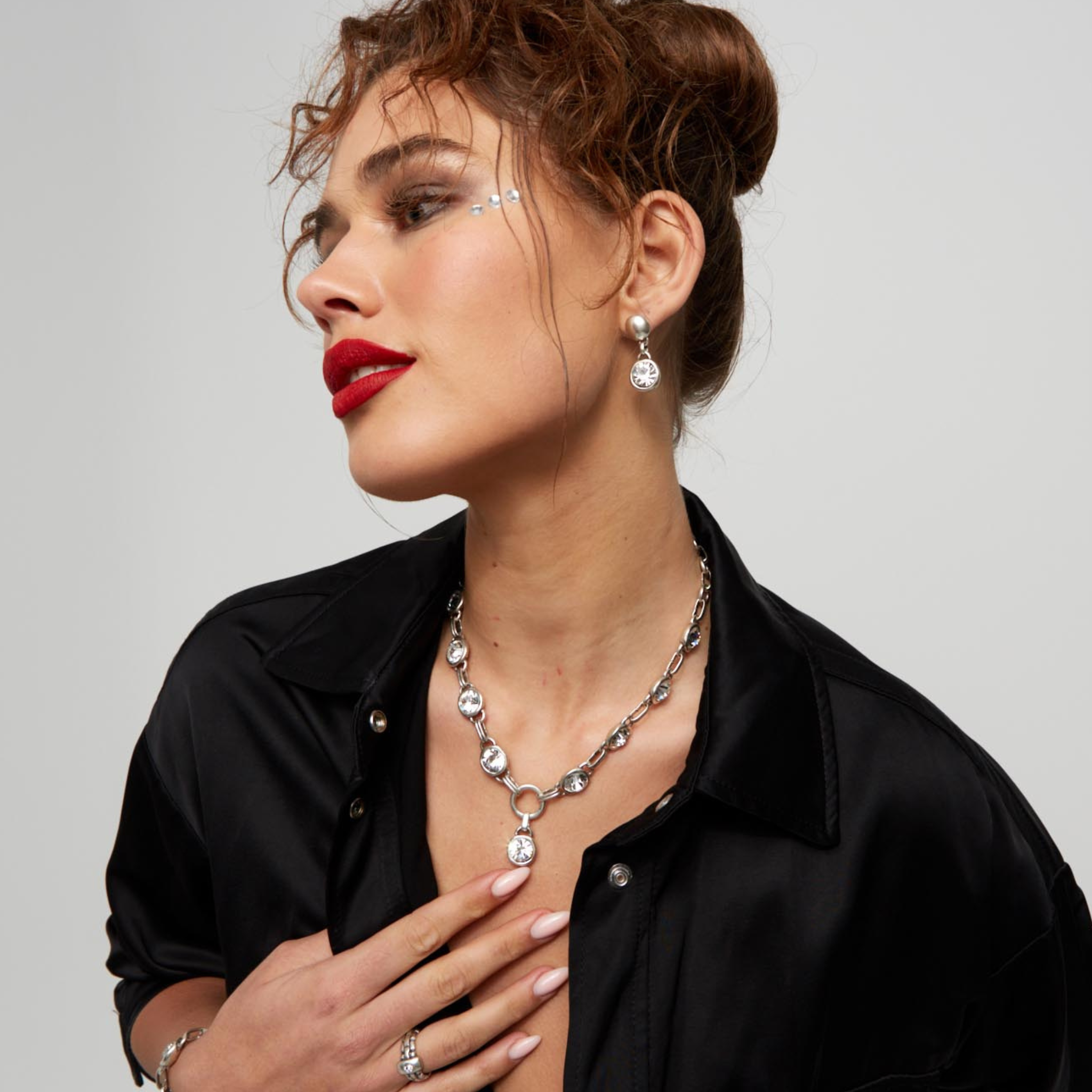 Aura Eyes Crystal Pewter Necklace by Chanour featuring a detailed pewter pendant with crystal accents on a chain.