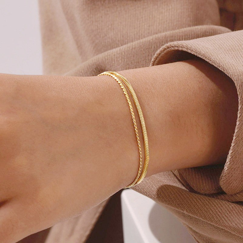 Stainless steel layered bracelet by Private Label Jewelry, showcasing a tarnish-free design with intricate detailing.