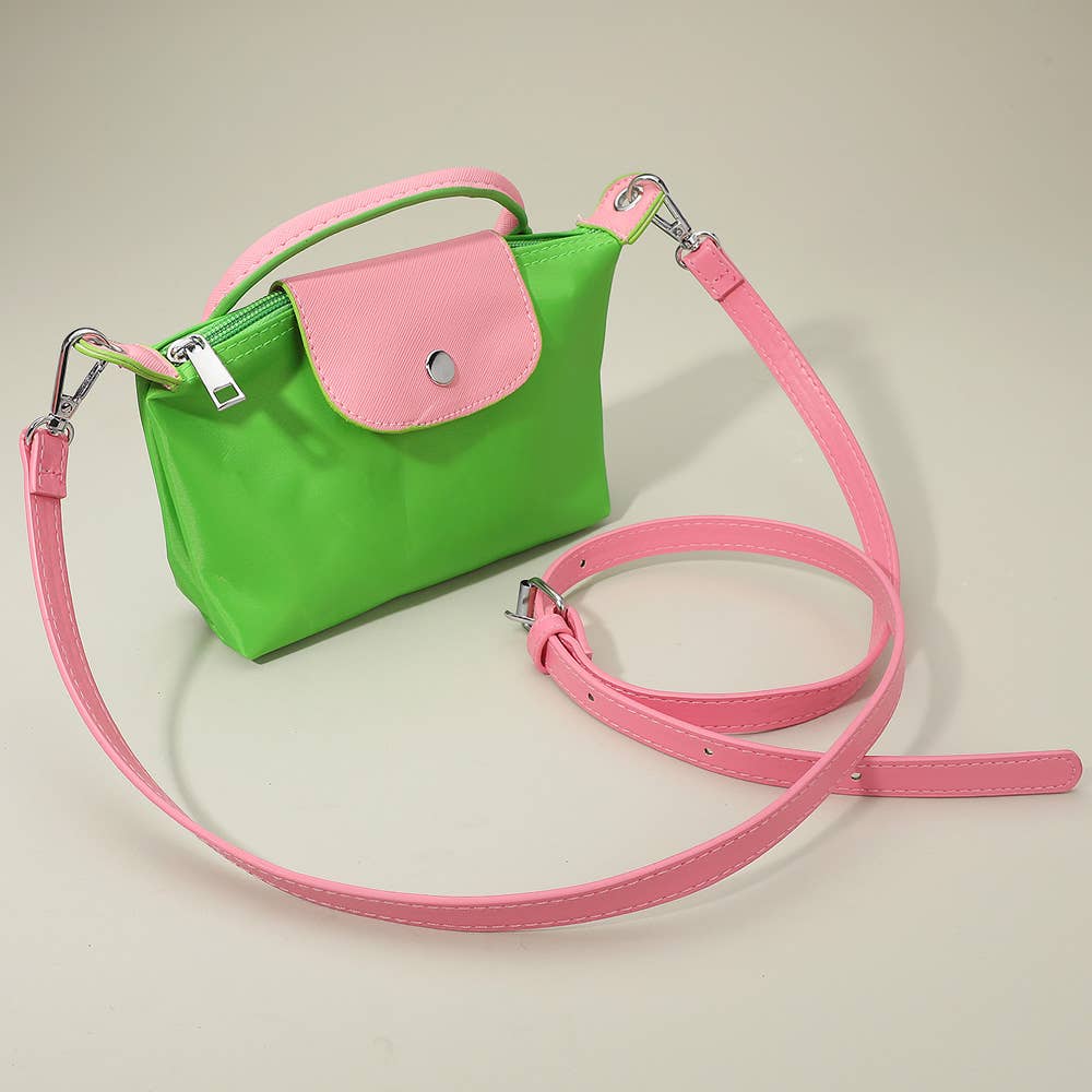 Private label compact two-tone handbag with crossbody strap, stylish accessory for everyday wear