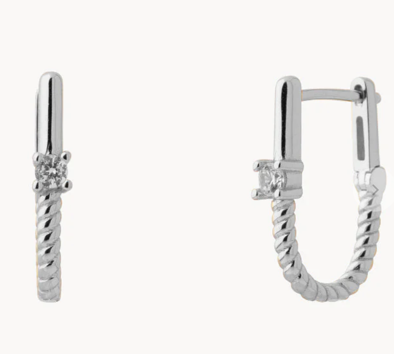 Roped In huggie hoop earrings in steel with 14K gold finish, showcasing a twisted design and sleek appearance.