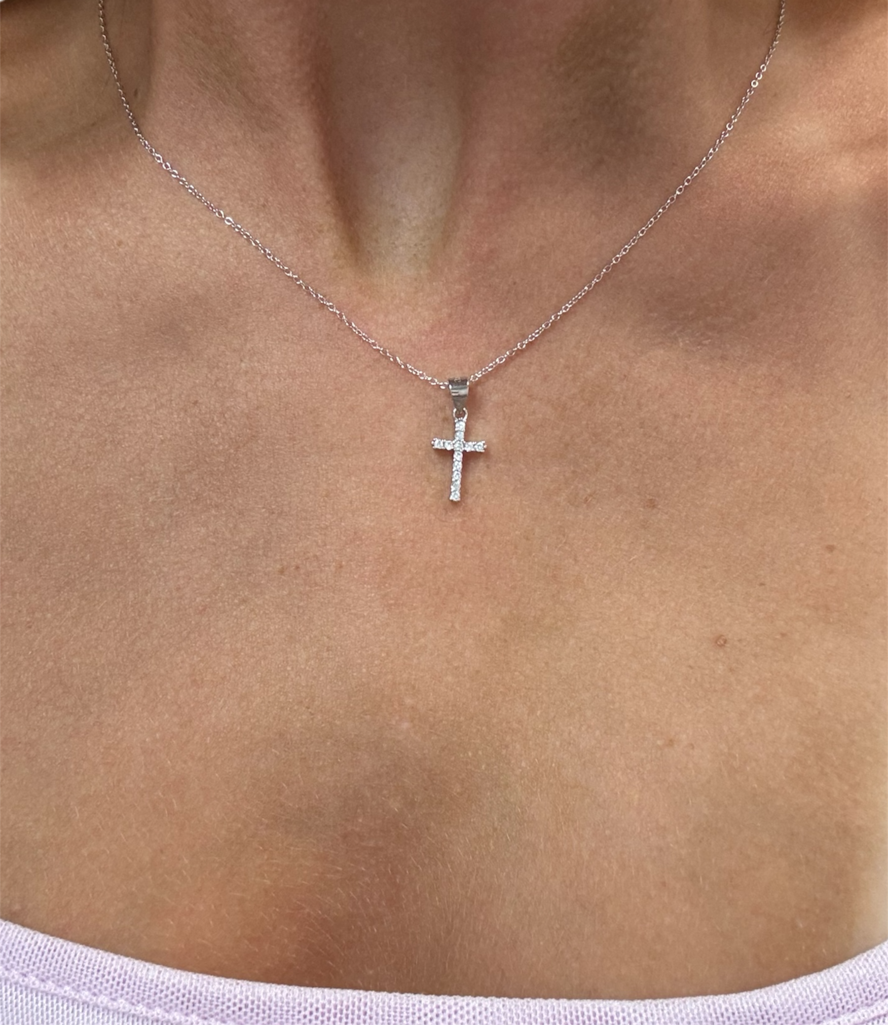Dainty sterling silver 925 cross necklace with sparkling CZ accents from Private Label Jewelry.