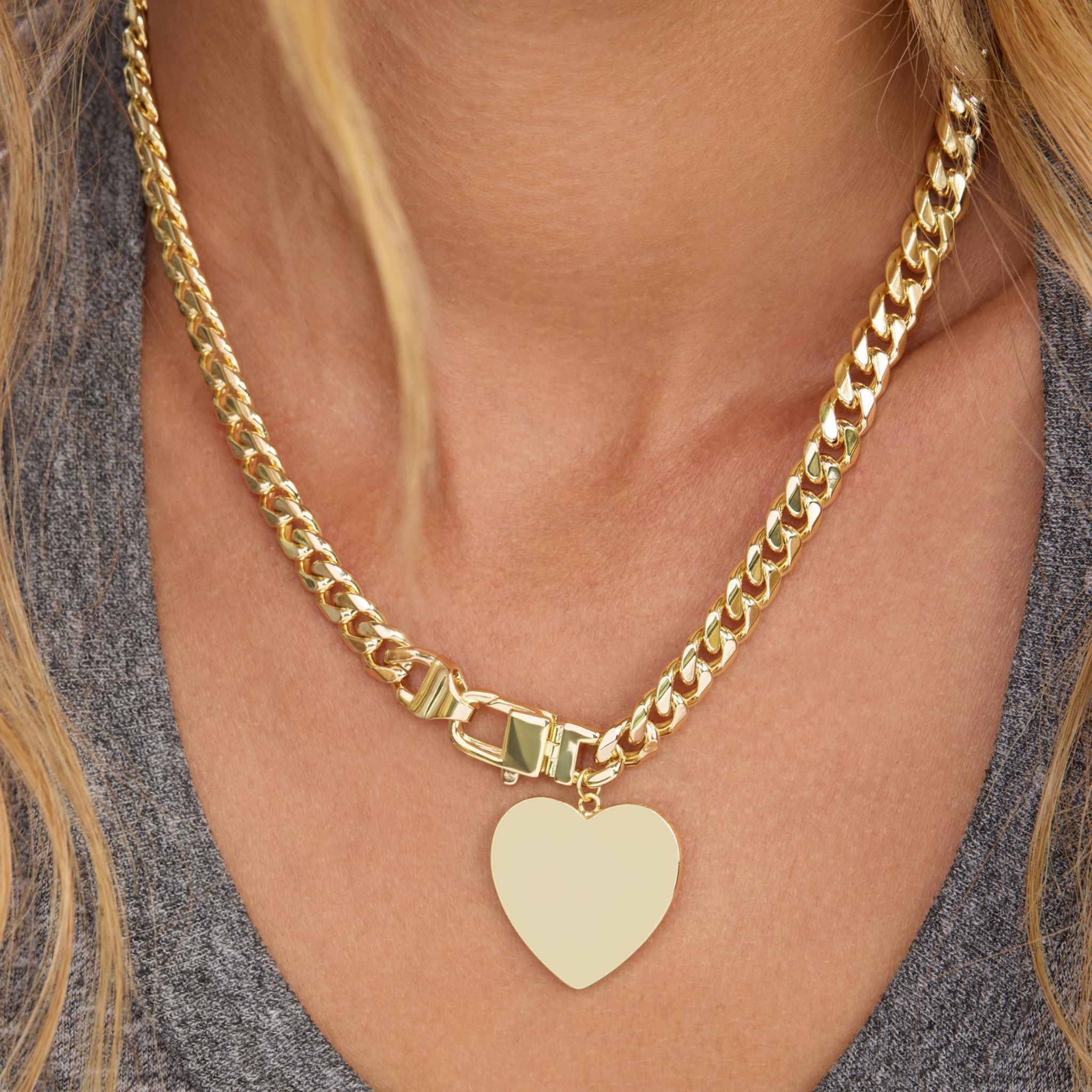 Julian XL Heart Cuban Chain Necklace by Melinda Maria, 6.8mm gold-plated necklace with heart-shaped links.